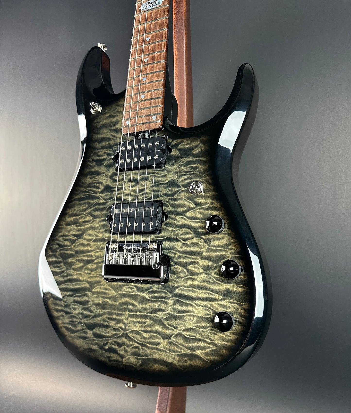 Front angle of Used 2007 Ernie Ball Family Reserve Petrucci Black Sunburst.