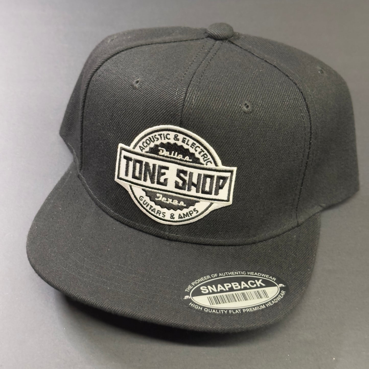 Front angle shot of Tone Shop Guitars Blackout Hat