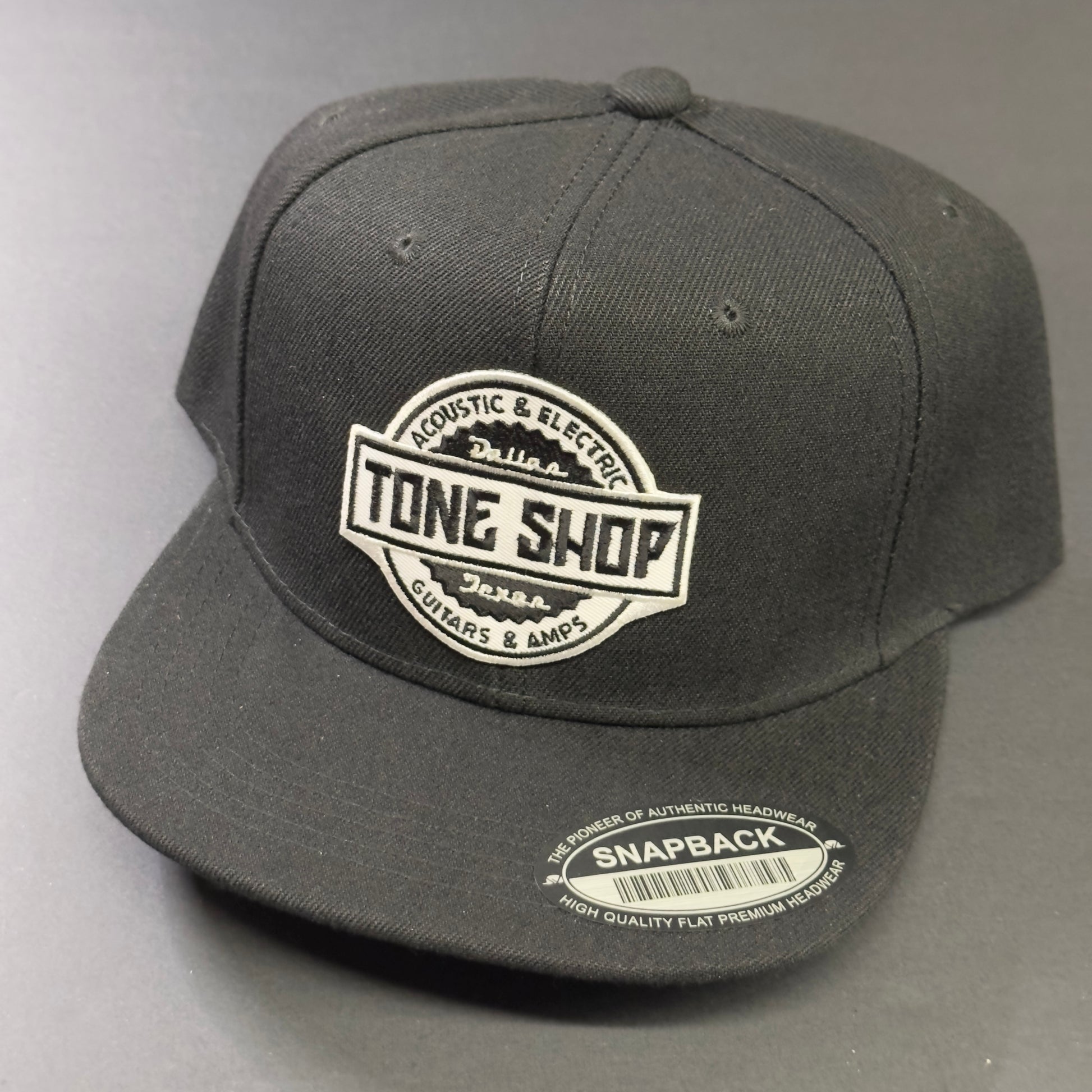 Front angle shot of Tone Shop Guitars Blackout Hat