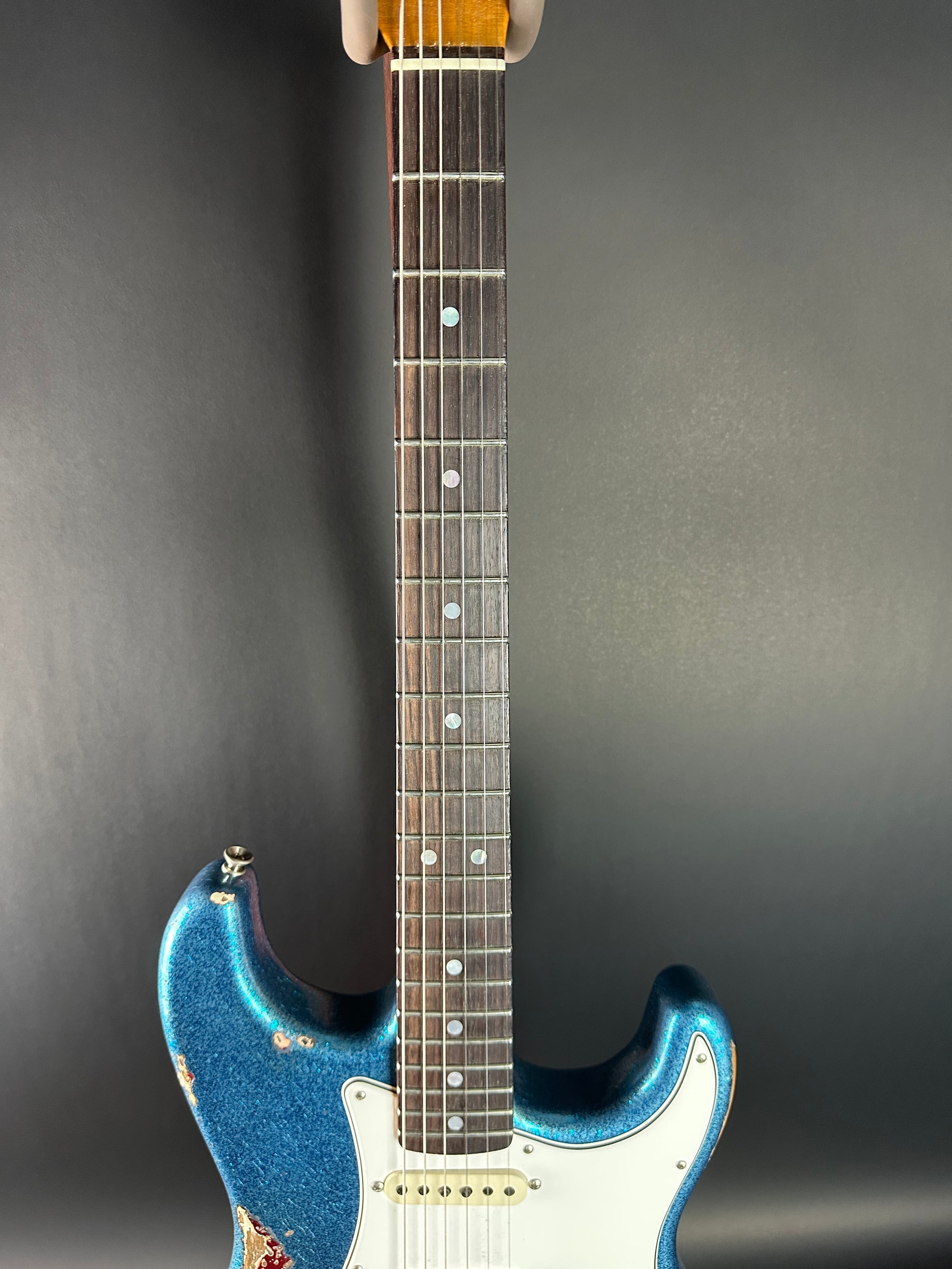 Fretboard of Used Fender Custom Shop GC Tex Strat Heavy Relic Blue Sparkle Over Candy Apple Red.