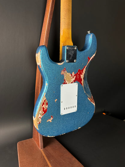 Back angle of Used Fender Custom Shop GC Tex Strat Heavy Relic Blue Sparkle Over Candy Apple Red.