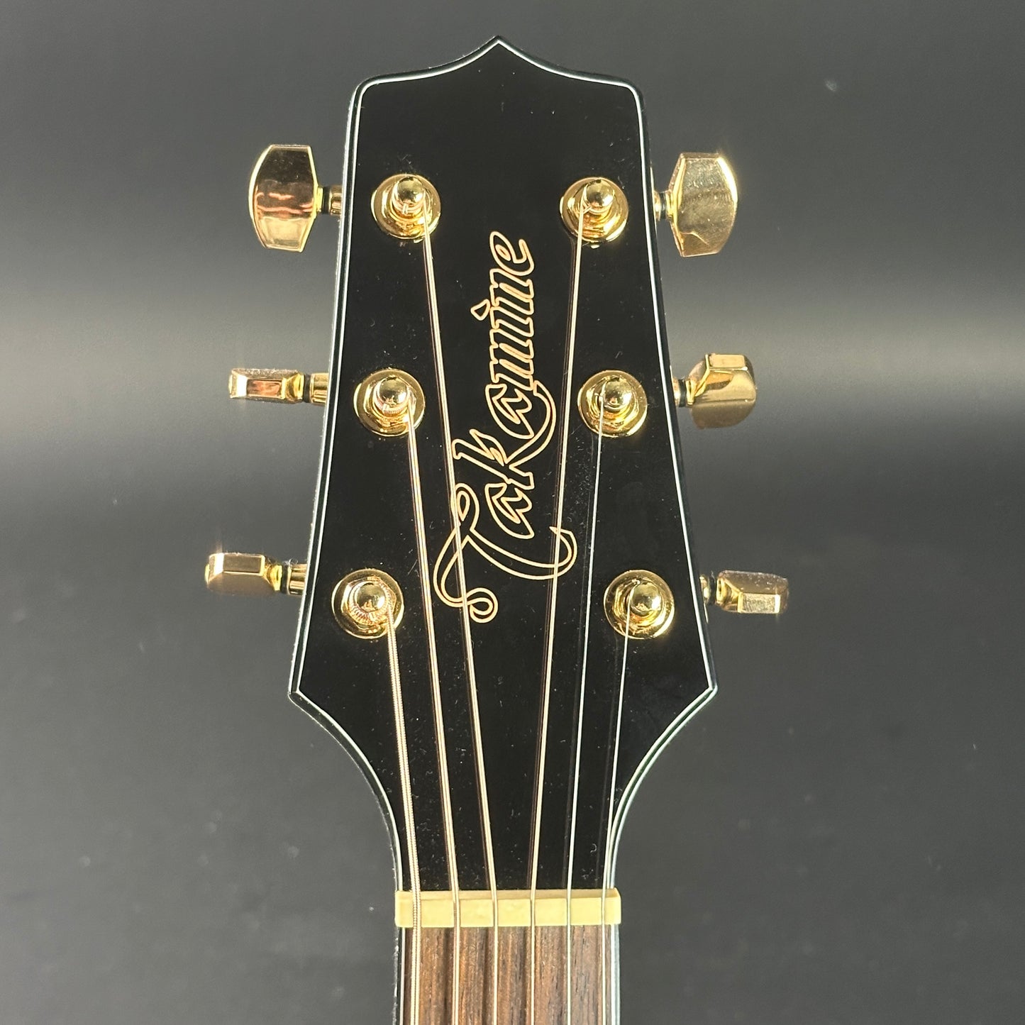 Front of headstock of Used Takamine GD35CE-PW.