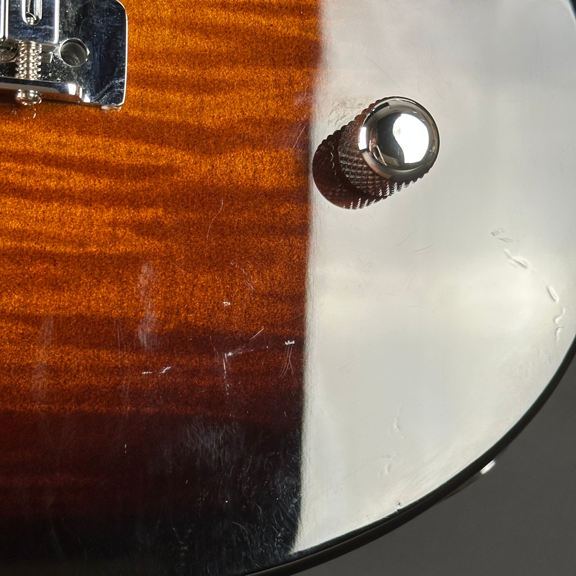 Scratches near controls of Used Yamaha Pacifica PAC212VFM Burst.