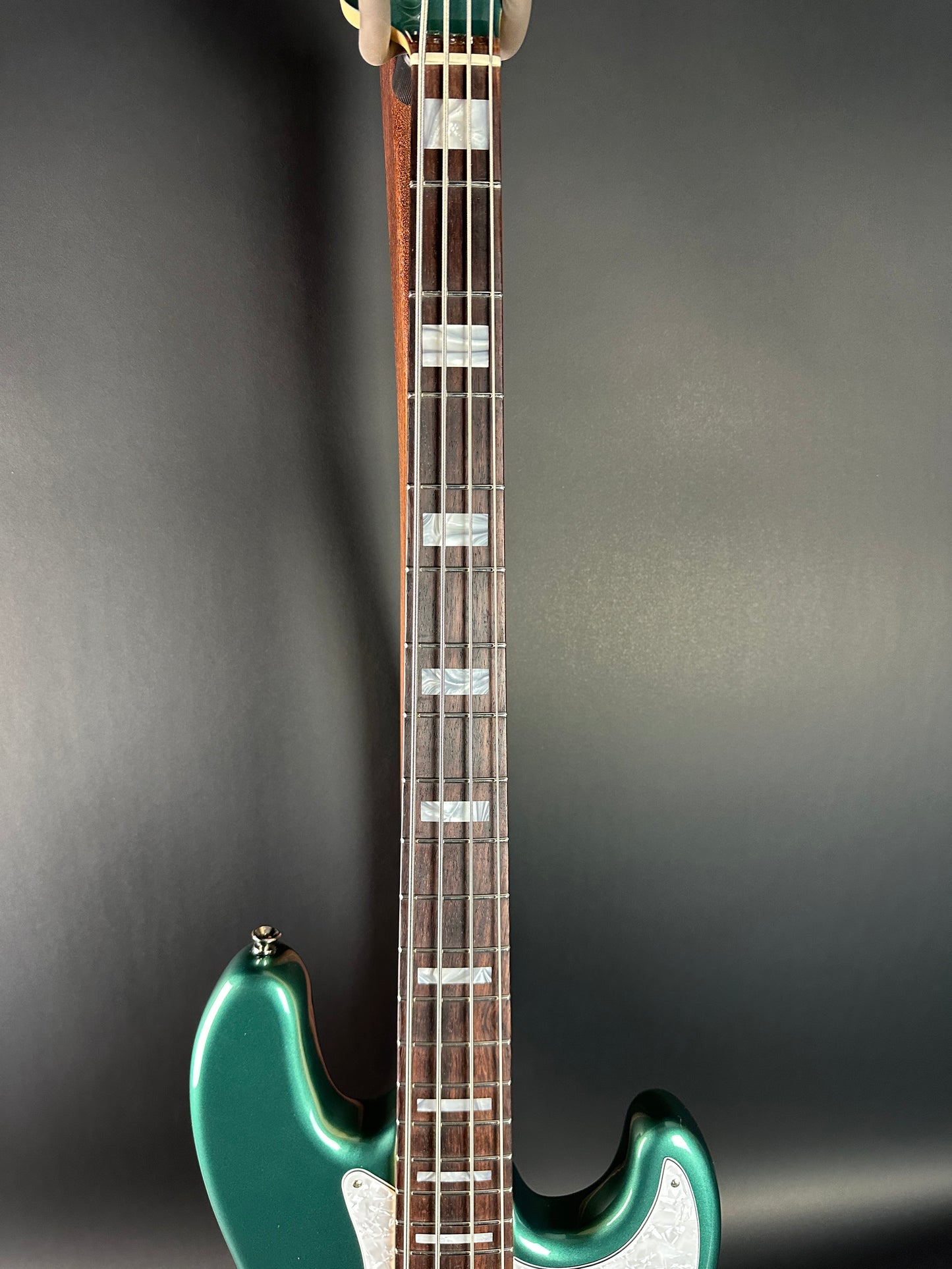 Fretboard of Used Fender Adam Clayton Jazz Bass Green.