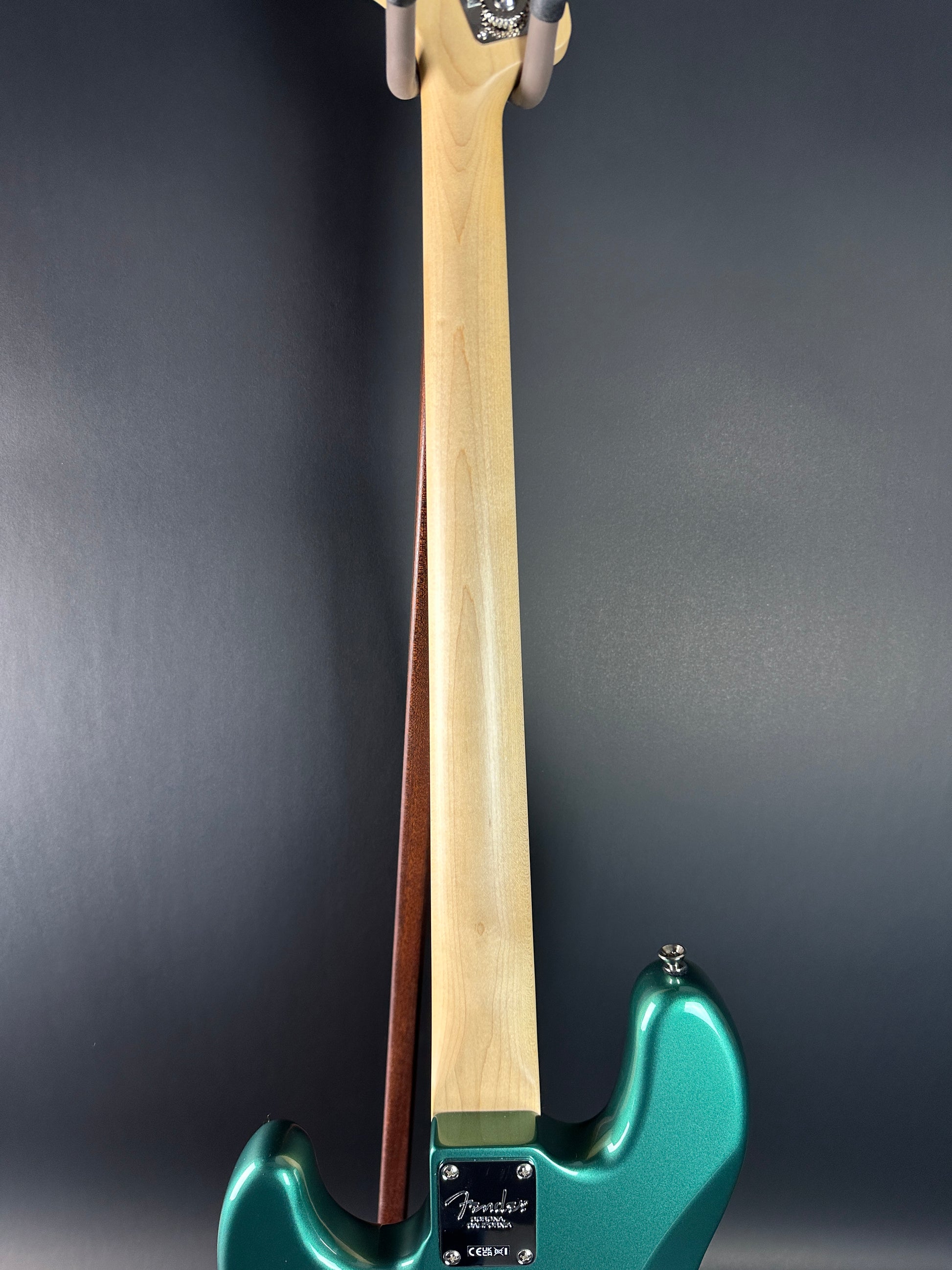 Back of neck of Used Fender Adam Clayton Jazz Bass Green.