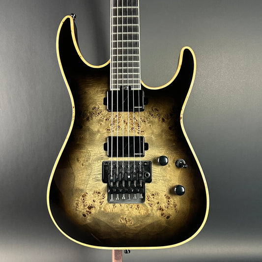 Front of Used Jackson Ltd Wildcard Series Soloist SL2P Transparent Black Burst.