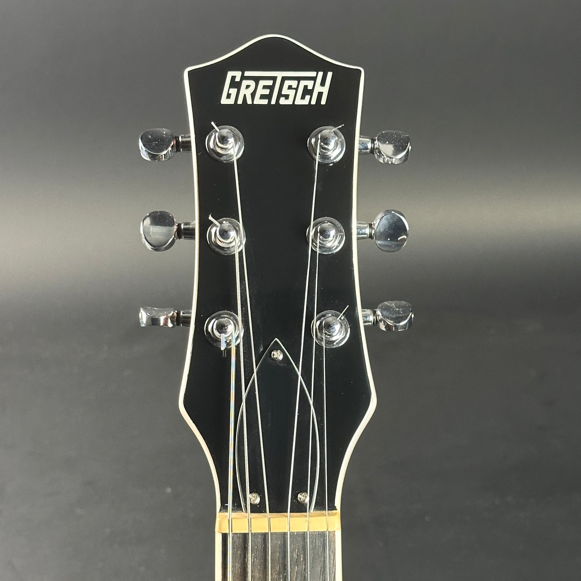 Headstock of Used Gretsch G5220 Firestick Red.