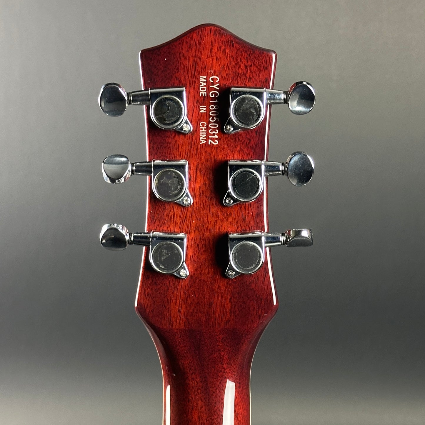 Back of headstock of Used Gretsch G5220 Firestick Red.