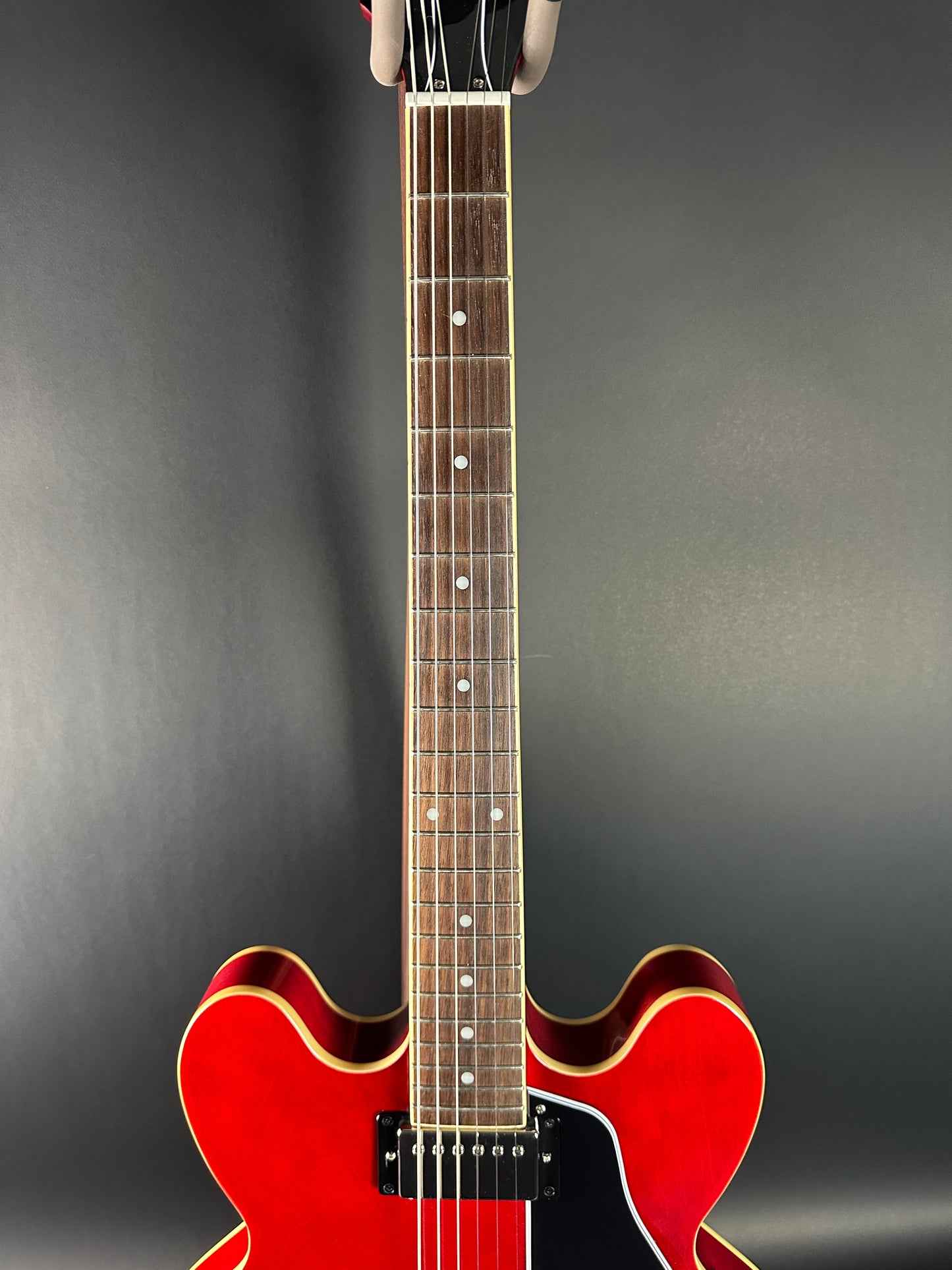 Fretboard of Used Epiphone Dot Cherry ES-335.