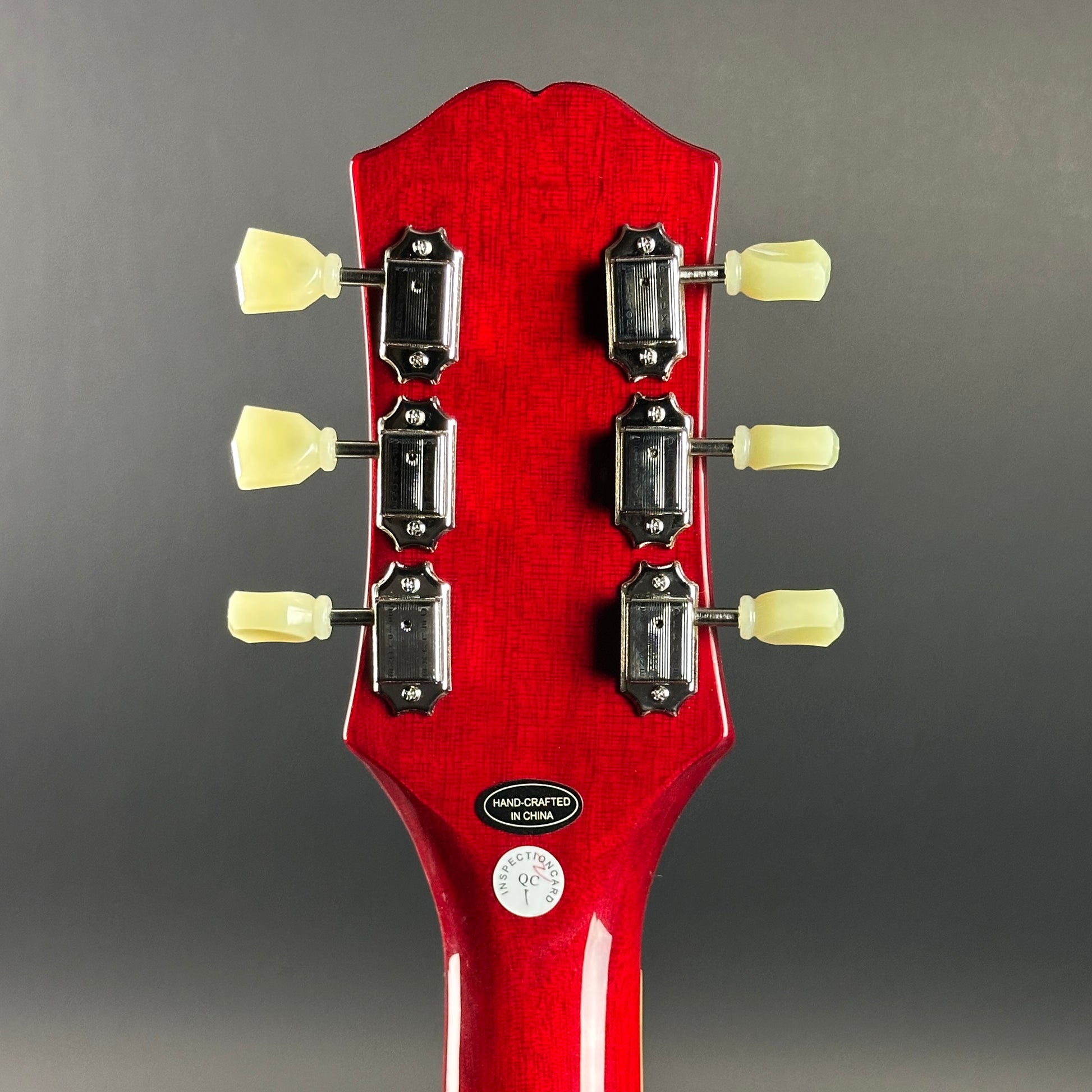 Back of headstock of Used Epiphone Dot Cherry ES-335.