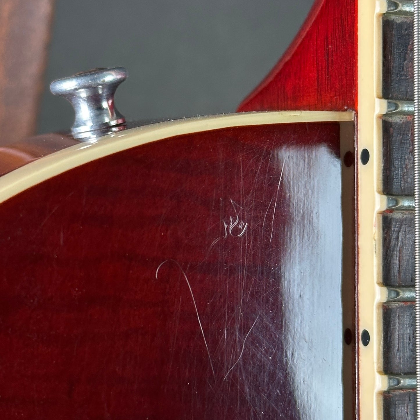 Scratches near top strap button of Used Gibson Les Paul Standard 60's Iced Tea.