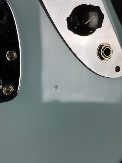 Dent near output jack of Used 2021 Fender Vintera Jaguar Mod Daphne Blue.