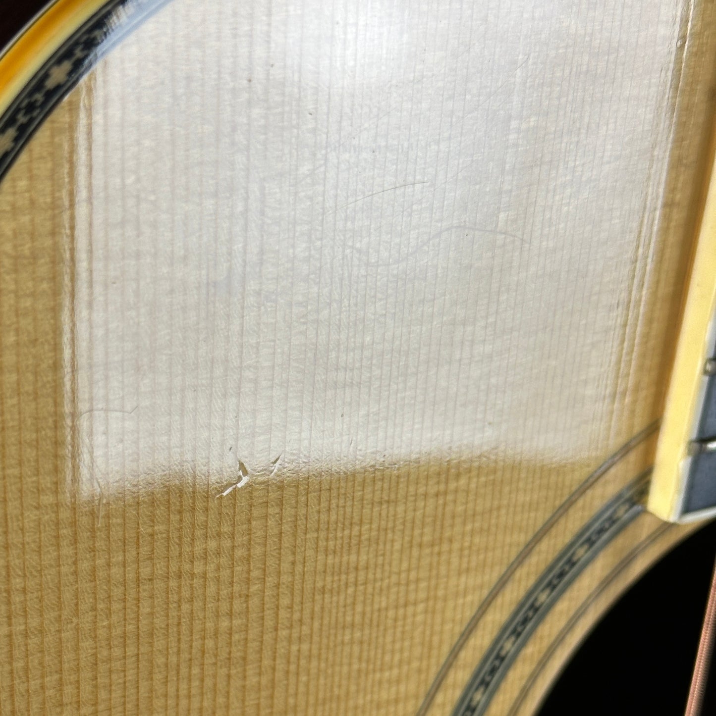 Dent near soundhole of Used 80s Yamaha L-10.