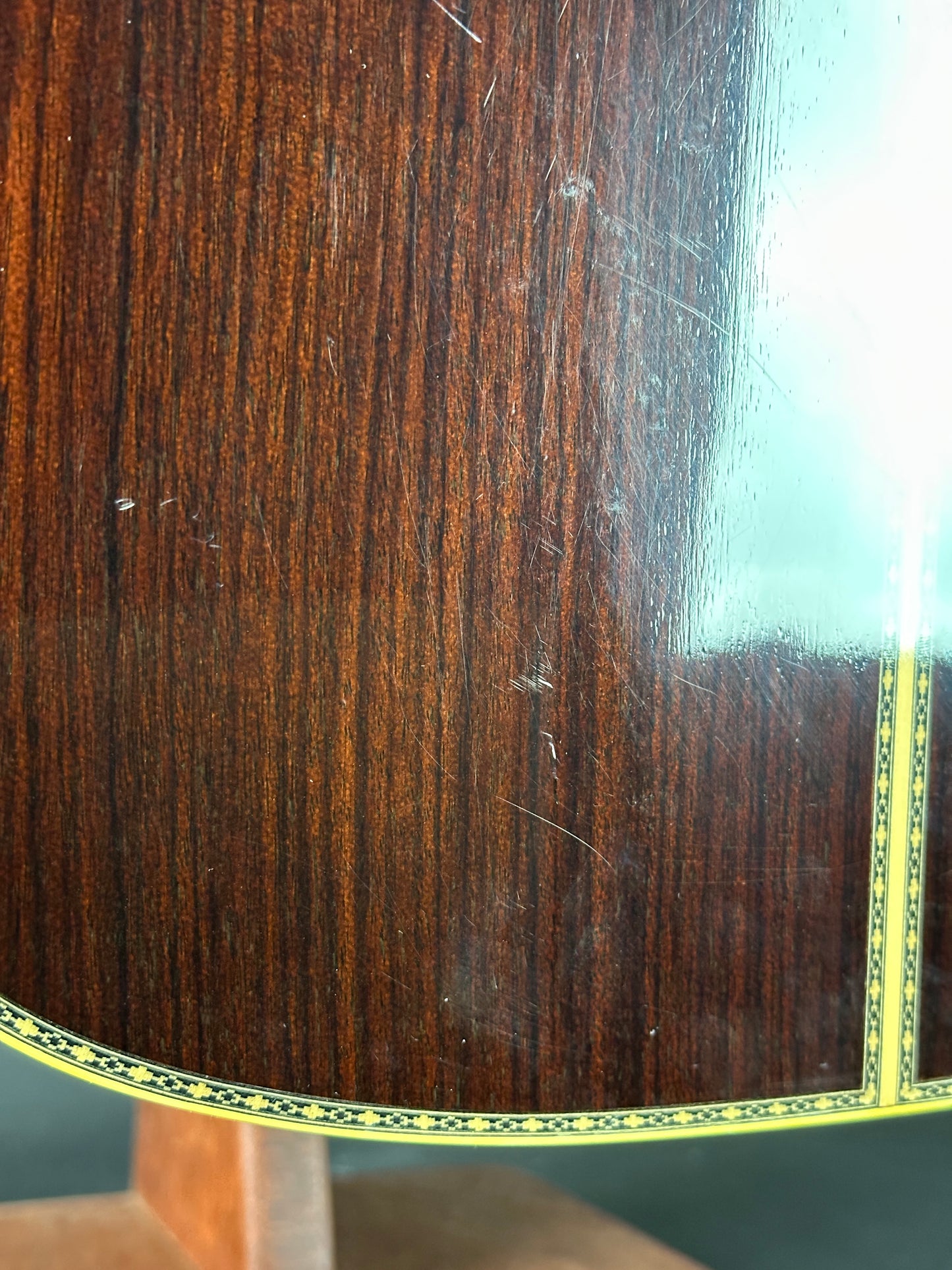 Scratches on back of Used 80s Yamaha L-10.