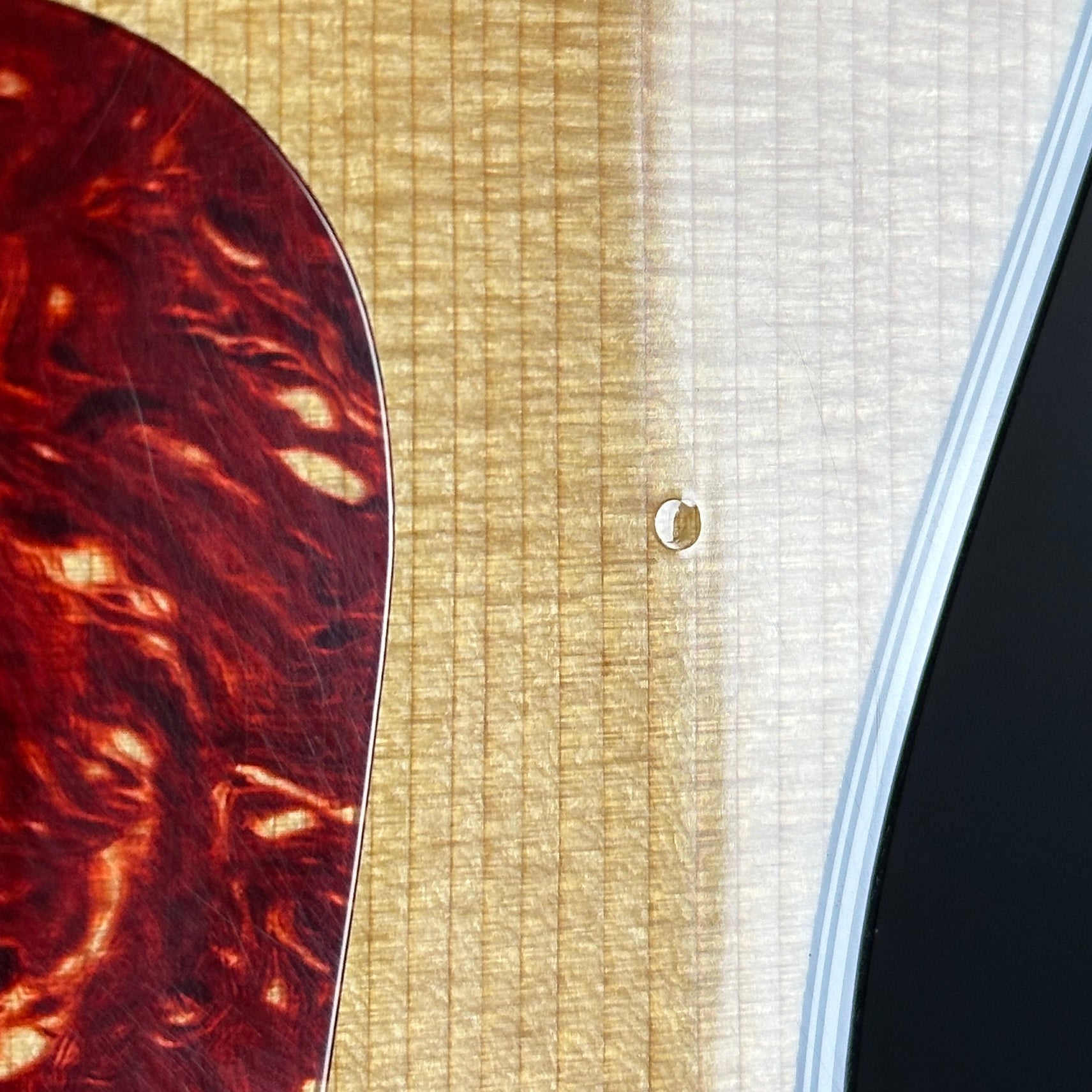 Dent near pickguard of Used 2012 Taylor 314ce.