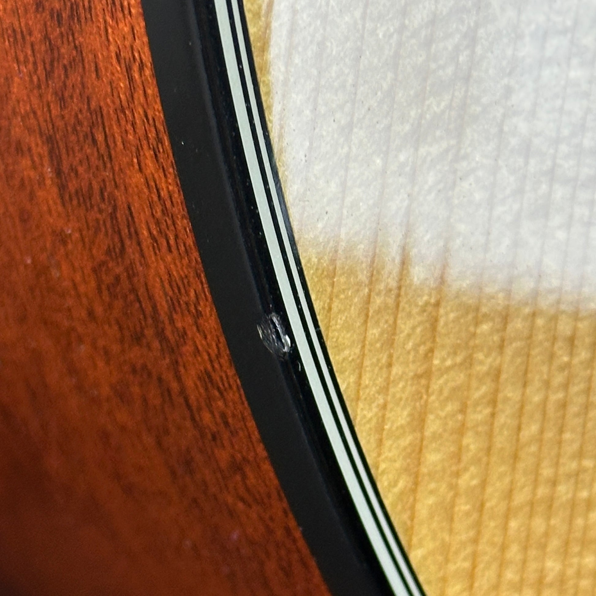 Dent on side edge of Used 2012 Taylor 314ce.