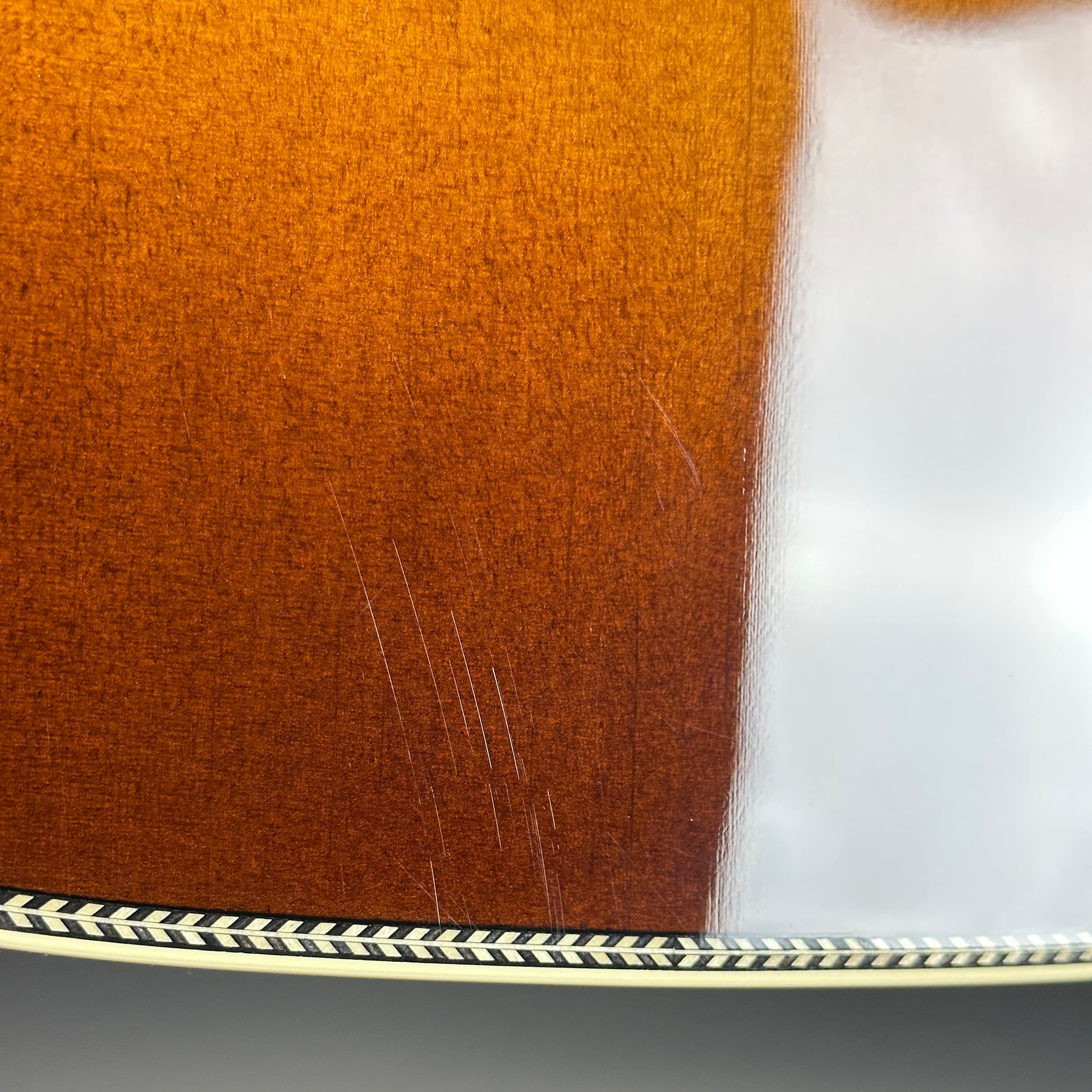 Scratches on body of Used Martin 000-28 Ambertone.