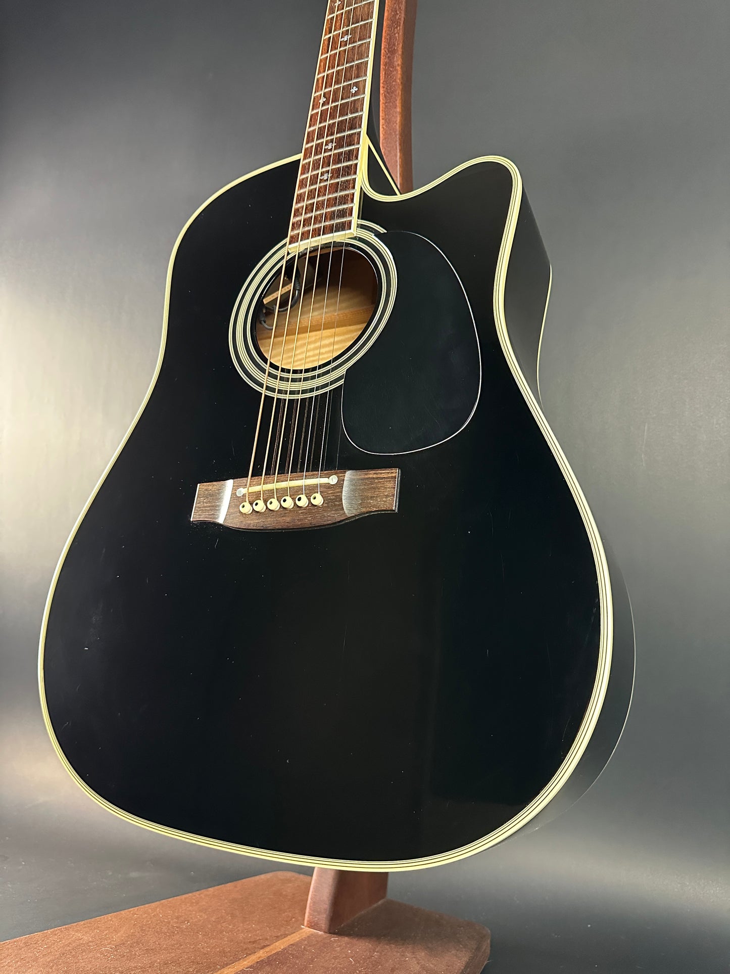 Front angle of Used Takamine EF341c Black.