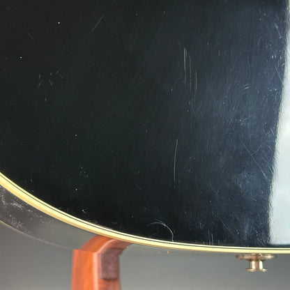 Scratches on back of Used Takamine EF341c Black.