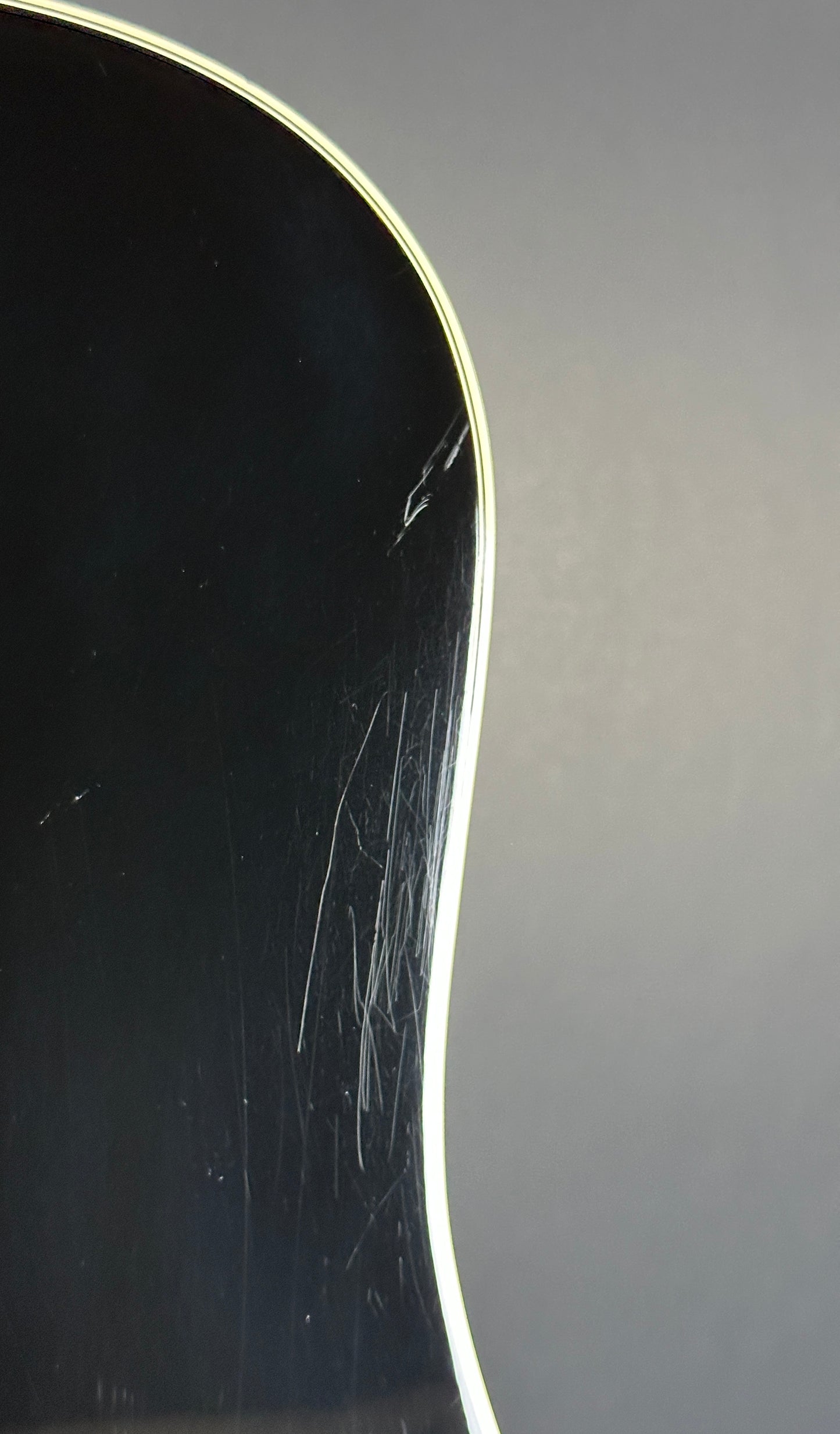 Scratches on back of Used Takamine EF341c Black.