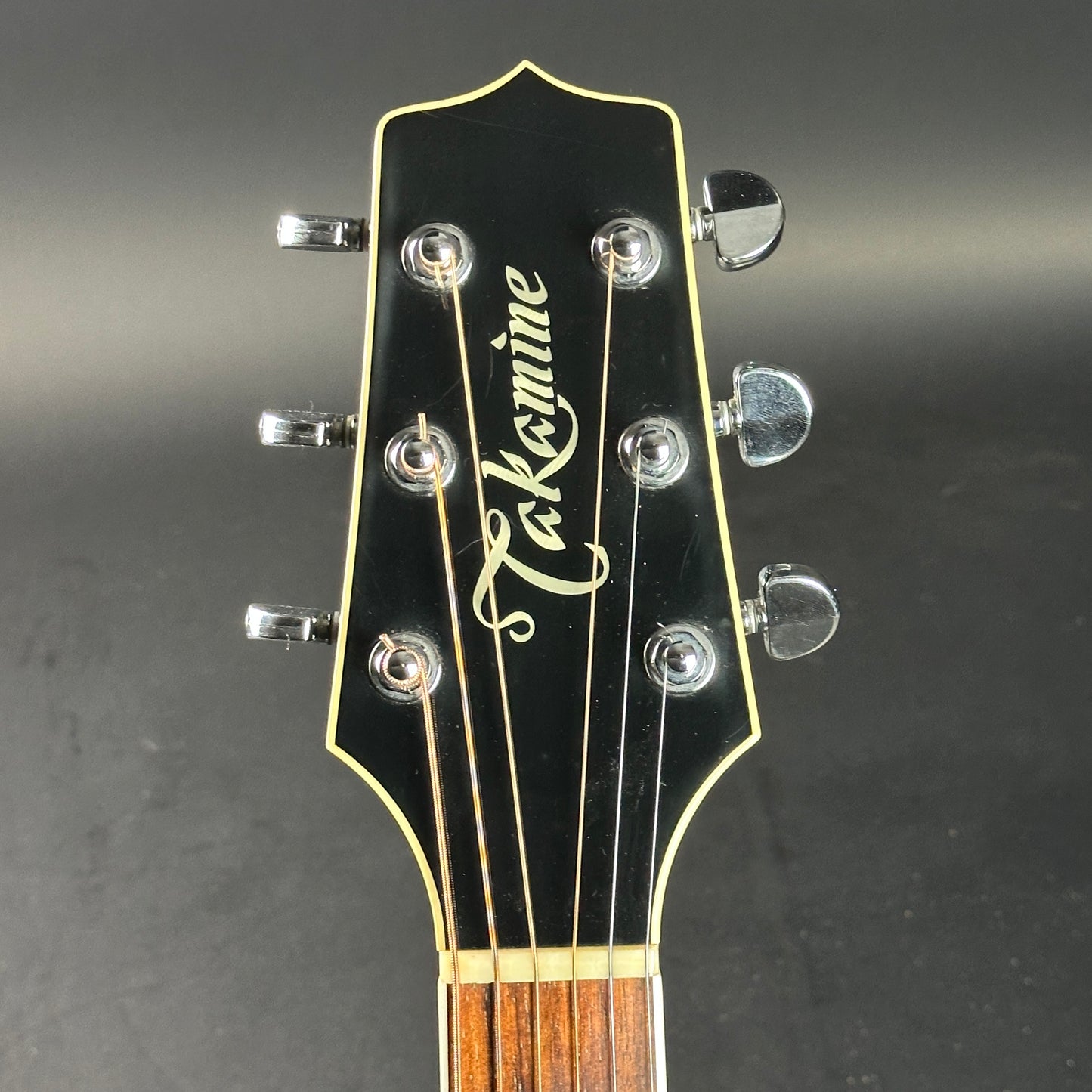 Headstock of Used Takamine EF341c Black.