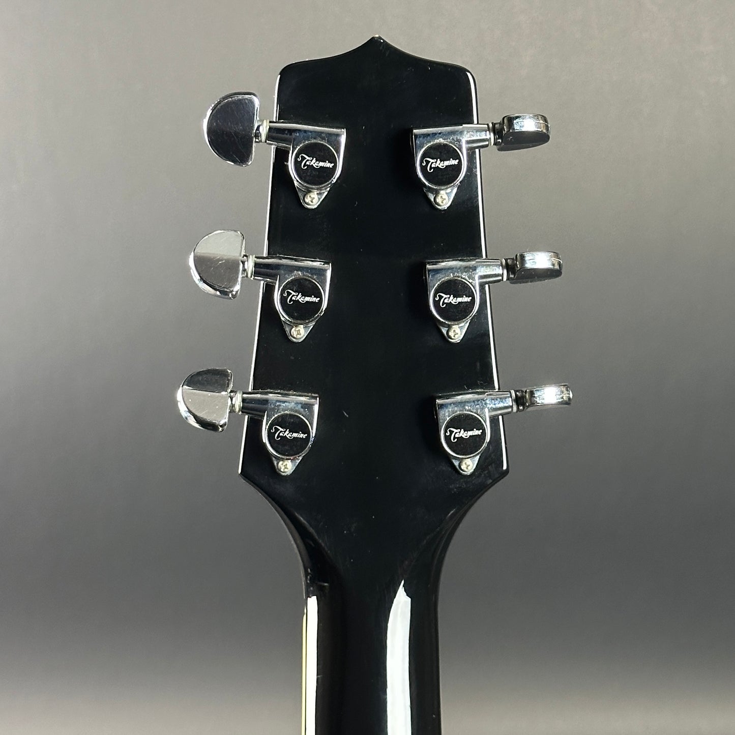 Back of headstock of Used Takamine EF341c Black.