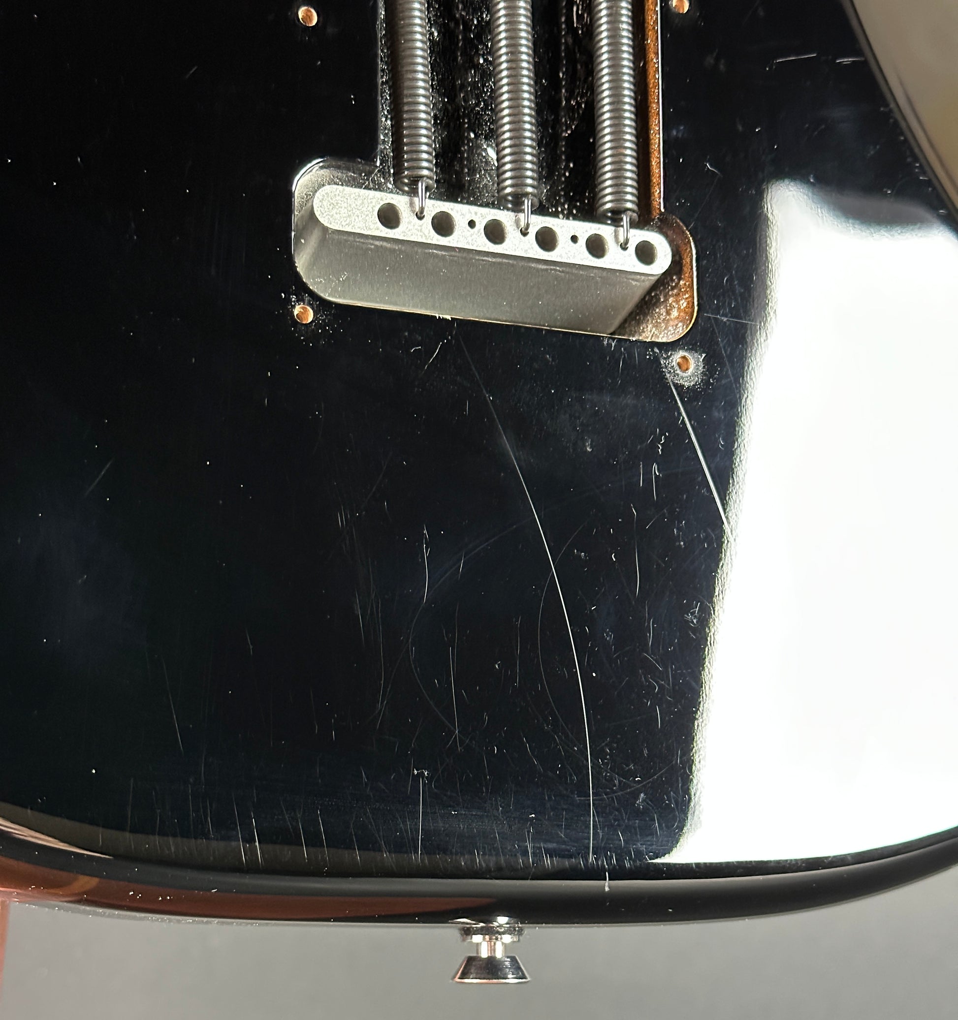 Scratches on back of Used 2013 Fender American Standard Strat Black.