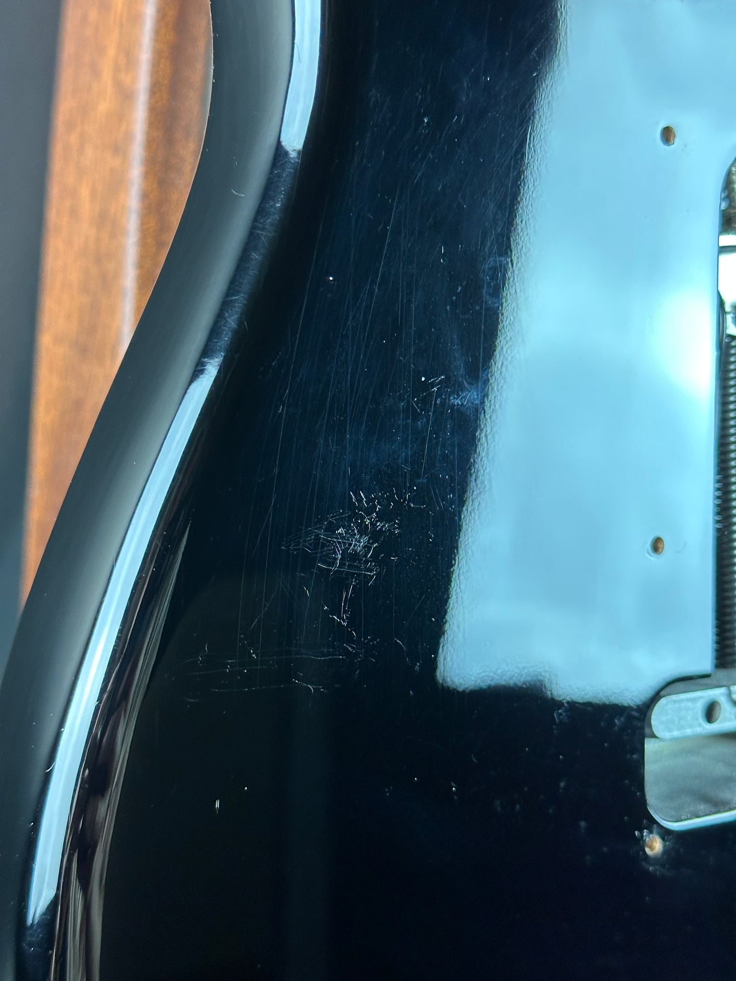 Scratches on back of Used 2013 Fender American Standard Strat Black.