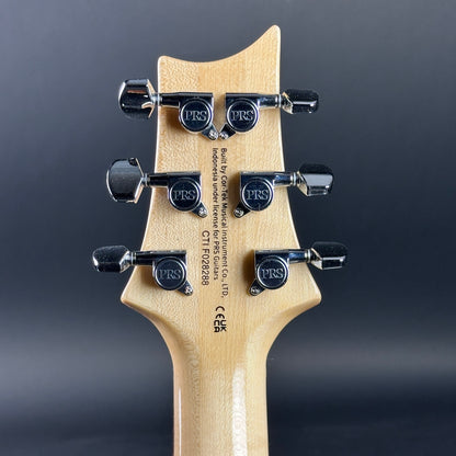 Back of headstock of Used PRS SE Custom 22 Semi-hollow Santana Yellow.