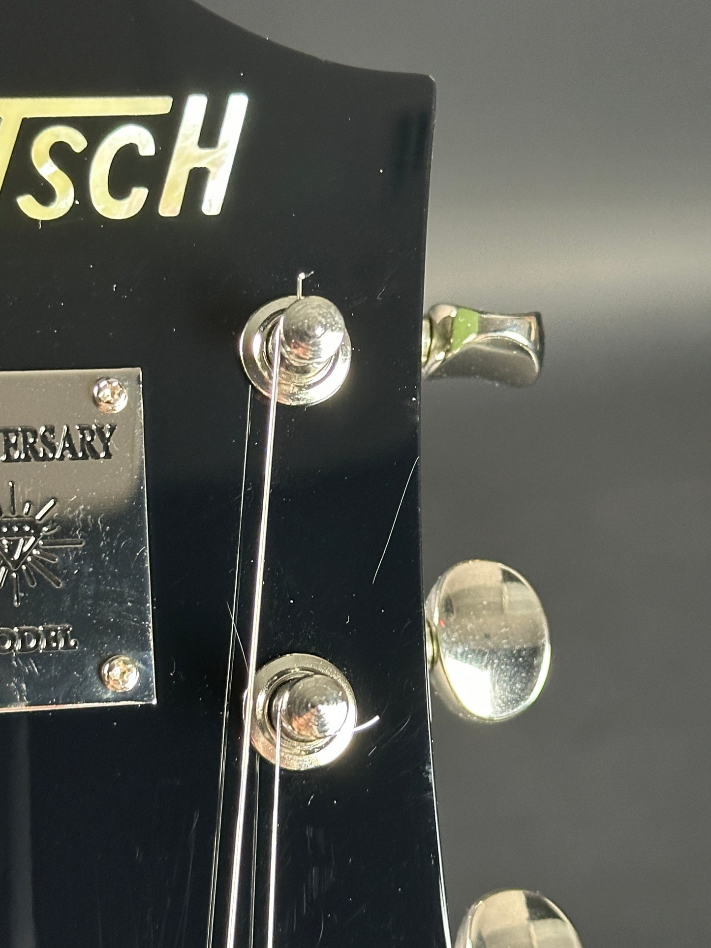 Scratches on headstock of Used Gretsch G6118T-60 Vintage Select 60th Anniversary Smoke Green.