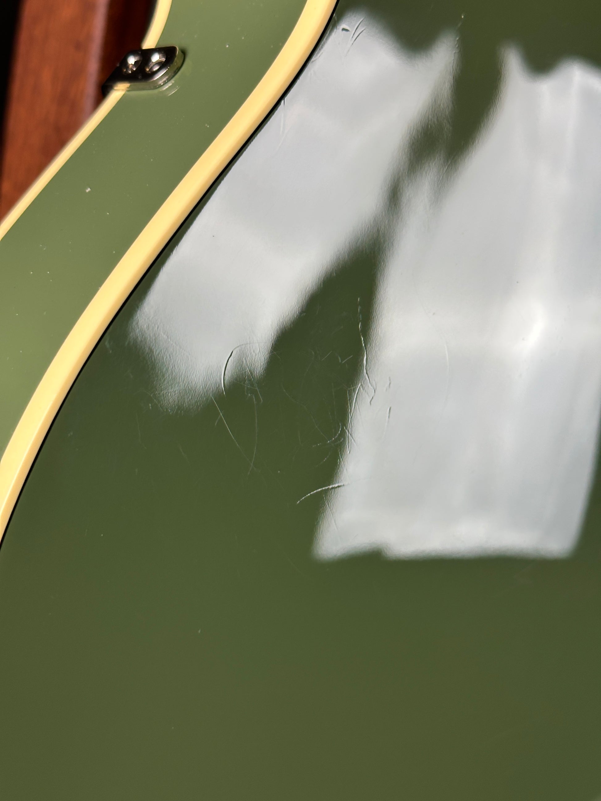 Scratches on back of Used Gretsch G6118T-60 Vintage Select 60th Anniversary Smoke Green.