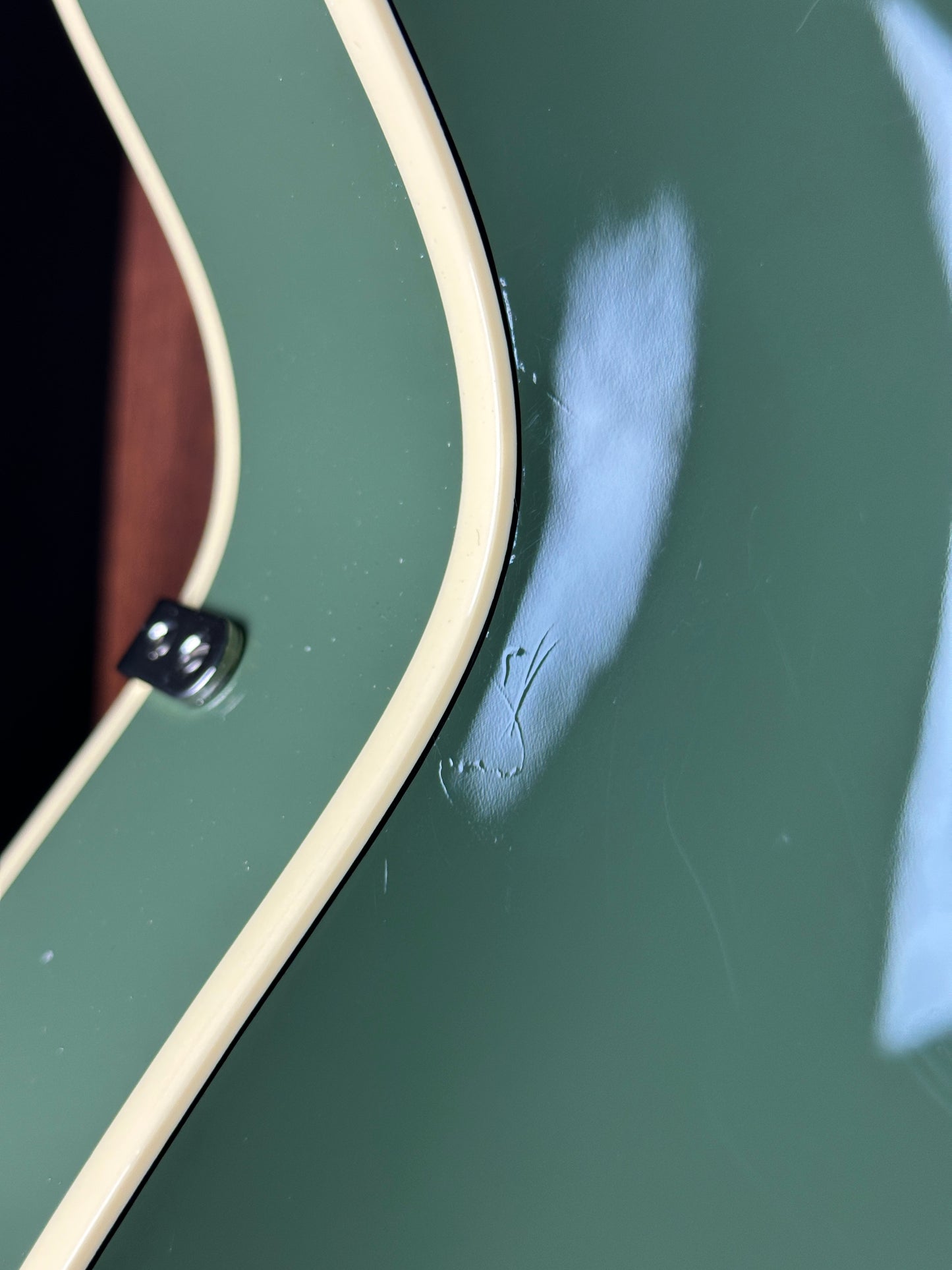 Scratches on back of Used Gretsch G6118T-60 Vintage Select 60th Anniversary Smoke Green.