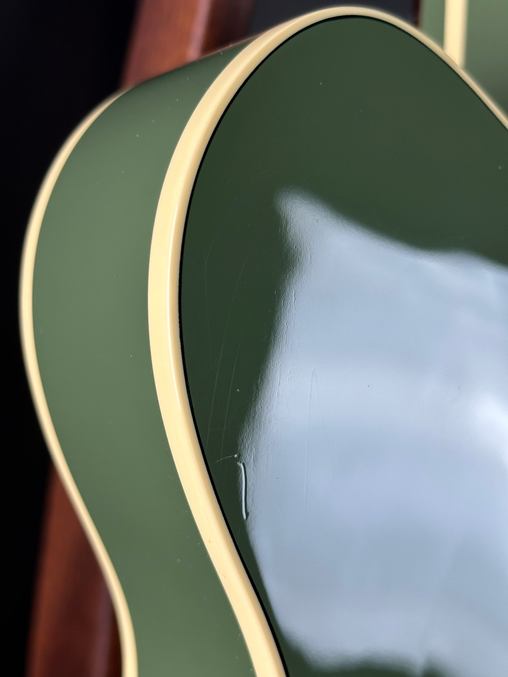 Scratches on back of Used Gretsch G6118T-60 Vintage Select 60th Anniversary Smoke Green.