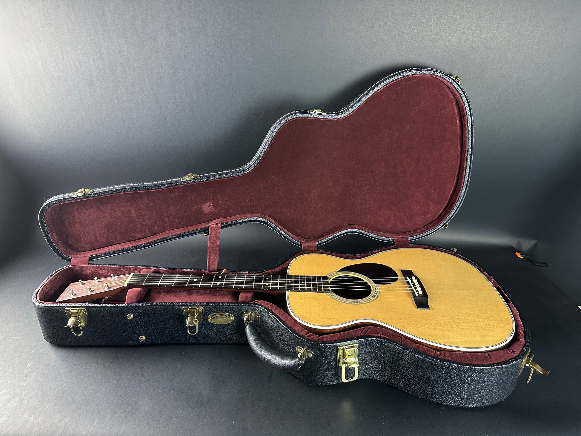 Used Martin OM-28 The Podium 50th Anniversary in case.