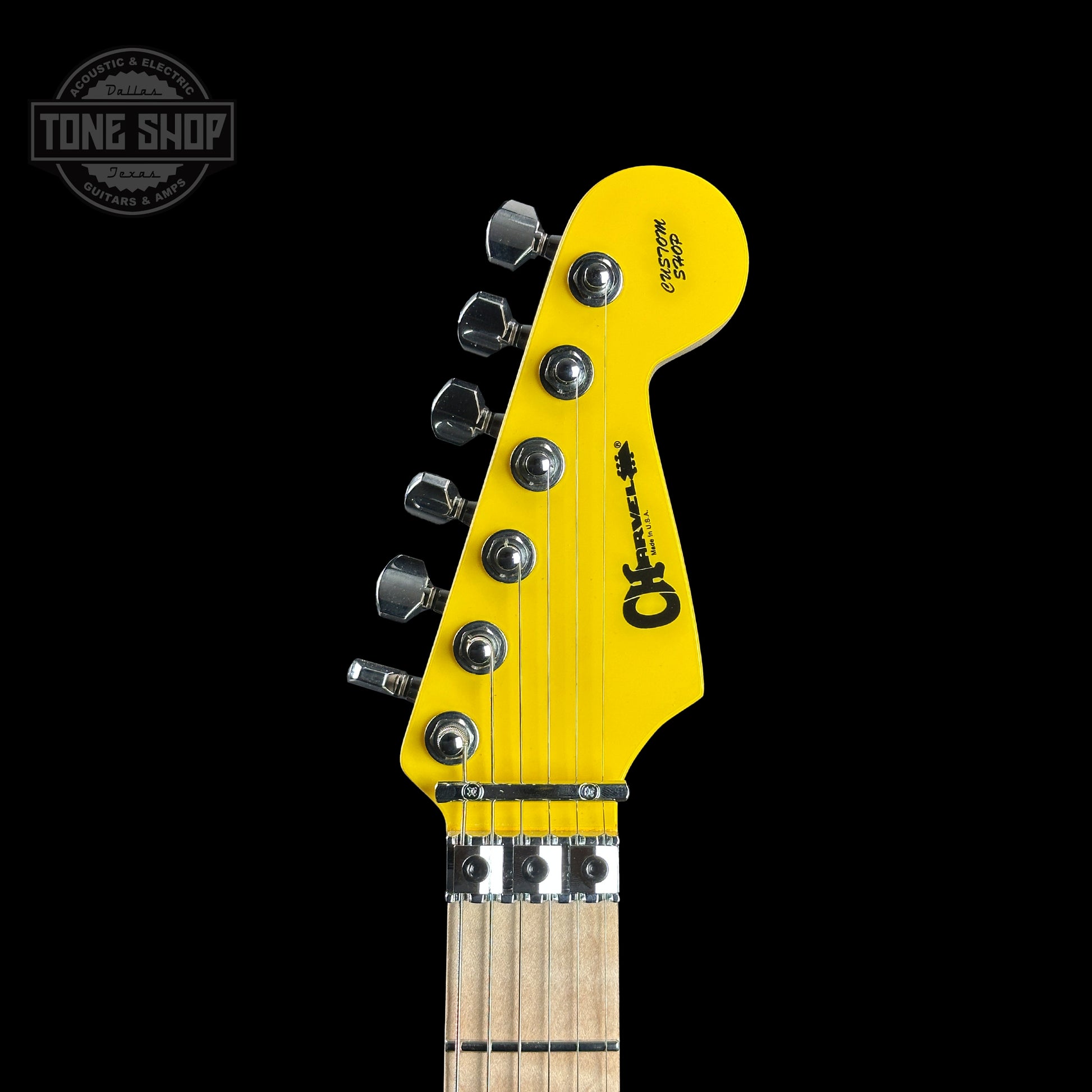 Front of headstock of Charvel Custom Shop San Dimas 2H FR Graffiti Yellow.