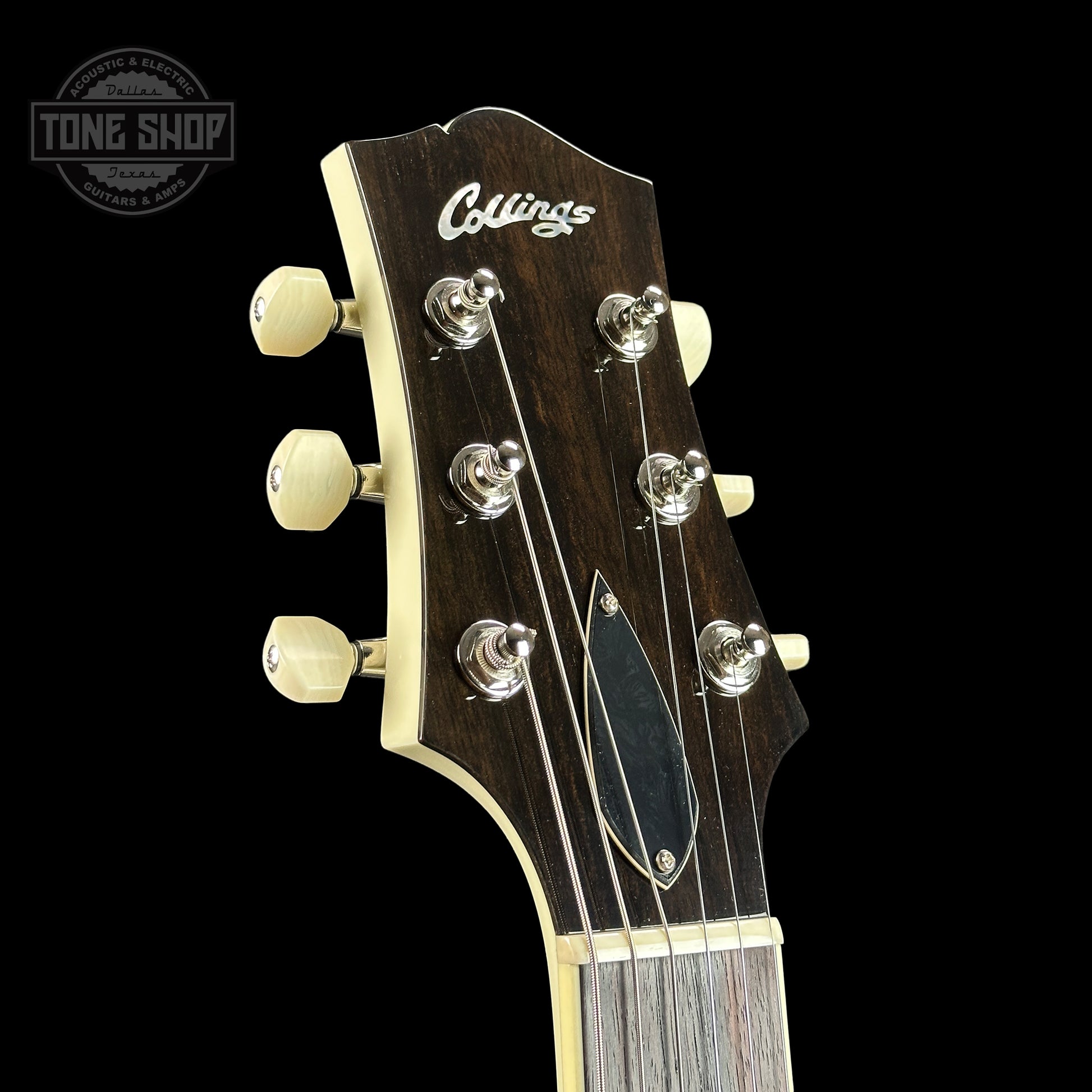 Front of headstock of Collings I30-LC  Olympic White.