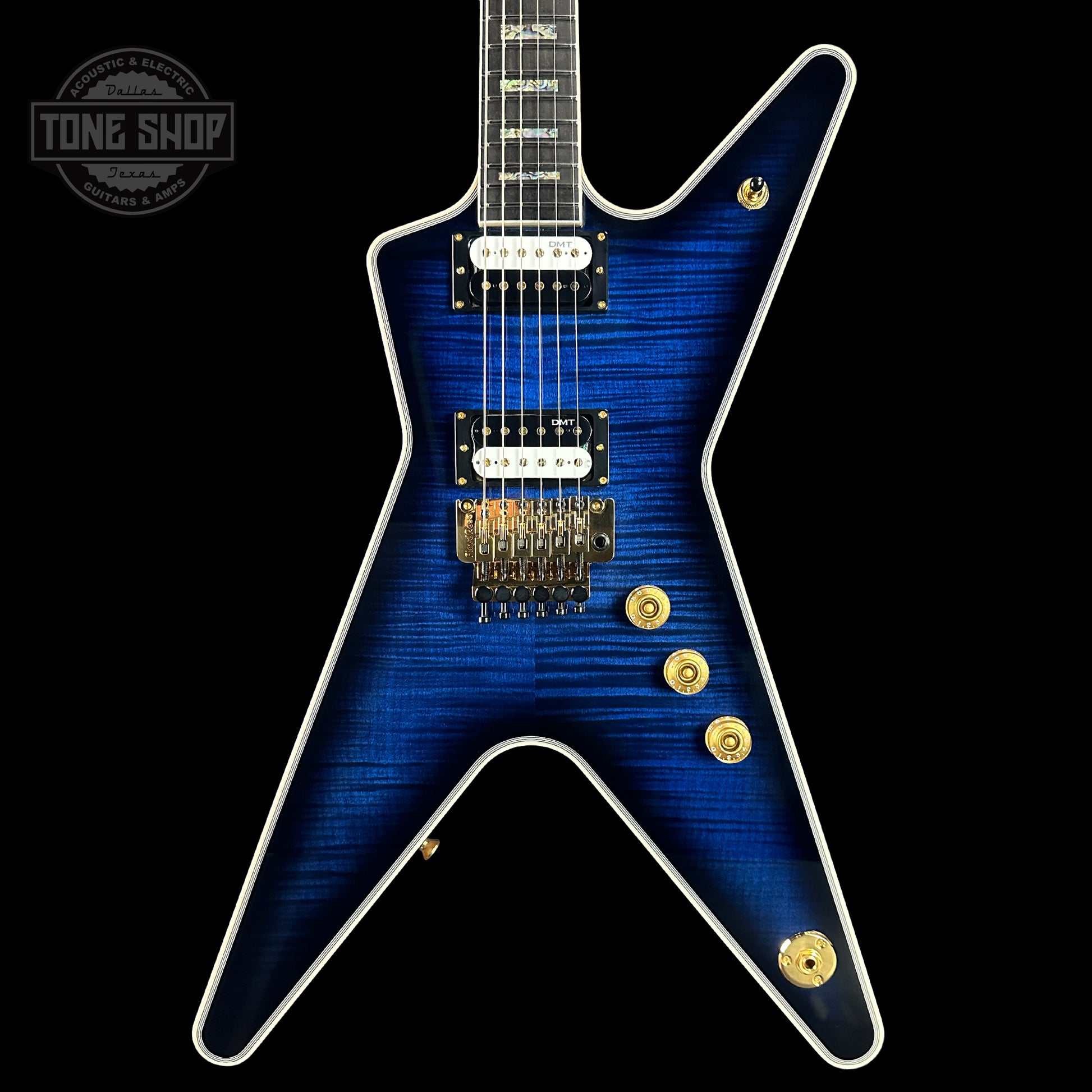 Front of Dean USA Custom Shop ML Trans Blue Flamed Maple Top Korina Body Gold Hardware.