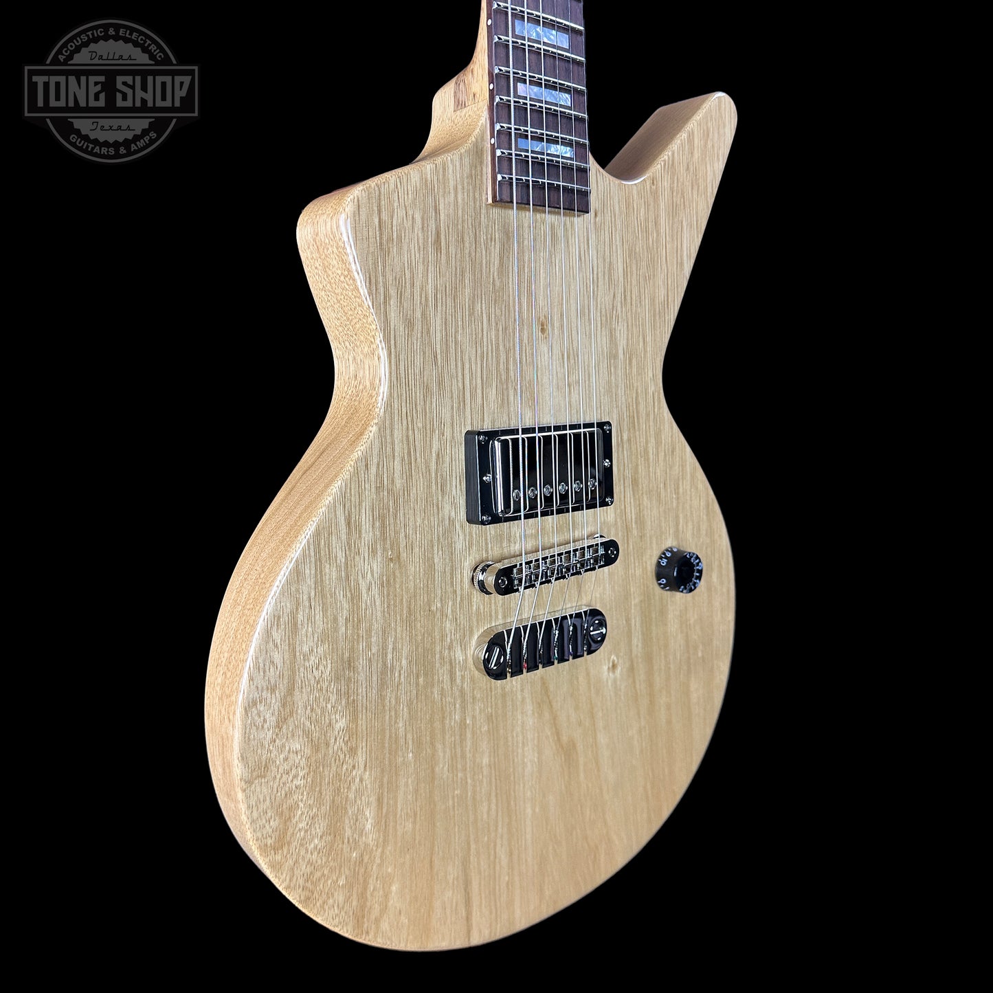 Front angle of Dean USA Custom Shop Cadillac Natural Korina Single Hum.