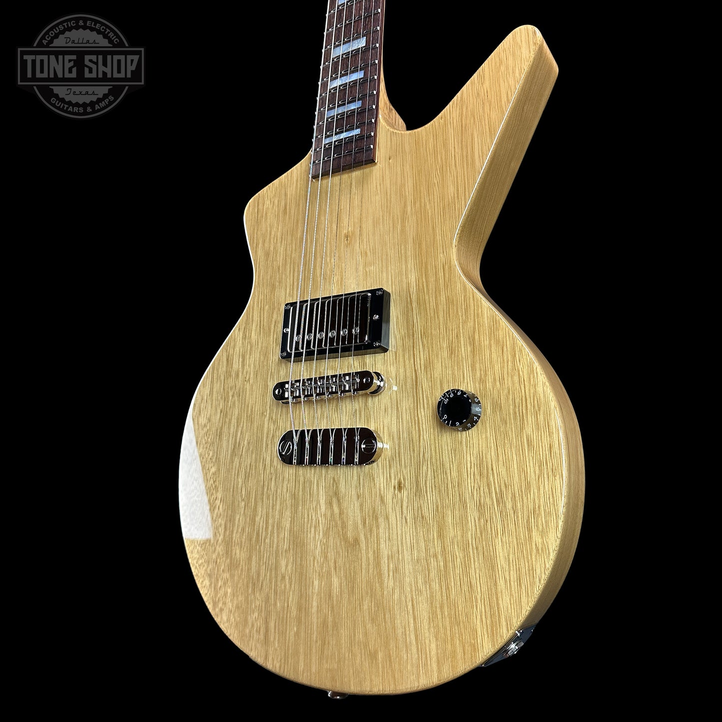 Front angle of Dean USA Custom Shop Cadillac Natural Korina Single Hum.