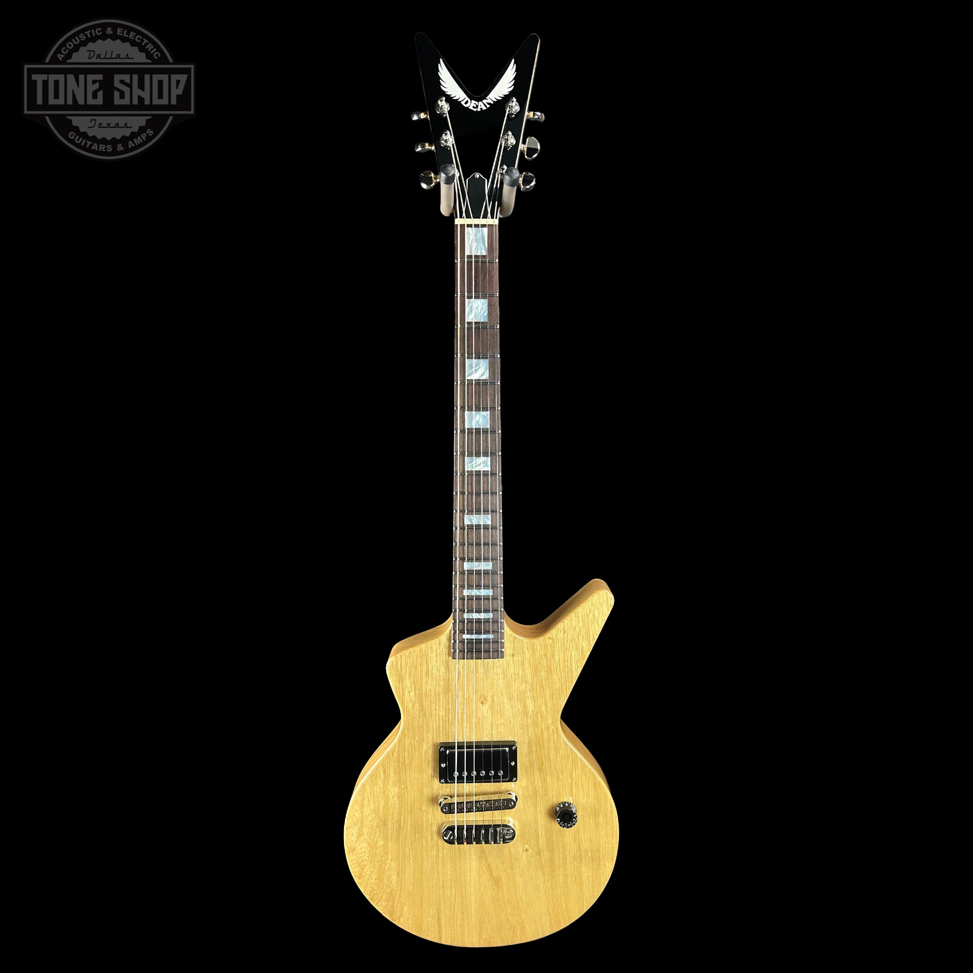 Full front of Dean USA Custom Shop Cadillac Natural Korina Single Hum.