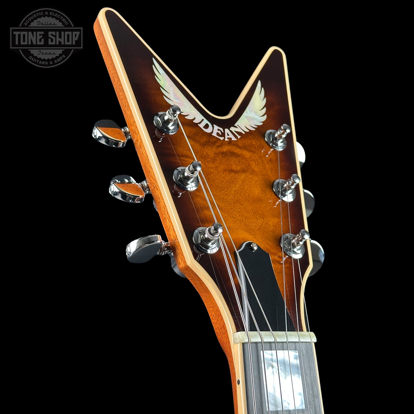 Headstock of Dean USA Custom Shop ML Custom Quilt Top Trans Tiger Eye.