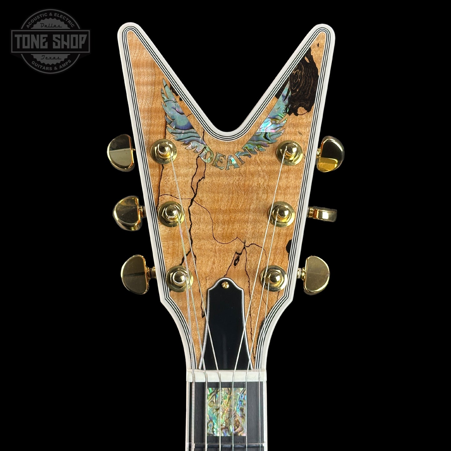 Front of headstock of Dean USA Custom Shop Cadillac Spalted Maple Gold Hardware.