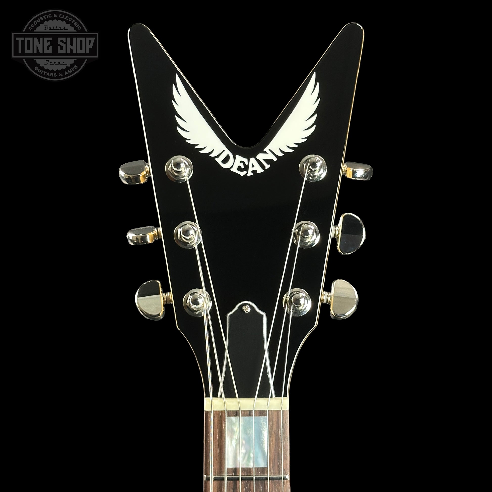 Front of headstock of Dean USA Custom Shop Cadillac Natural Korina Single Hum.