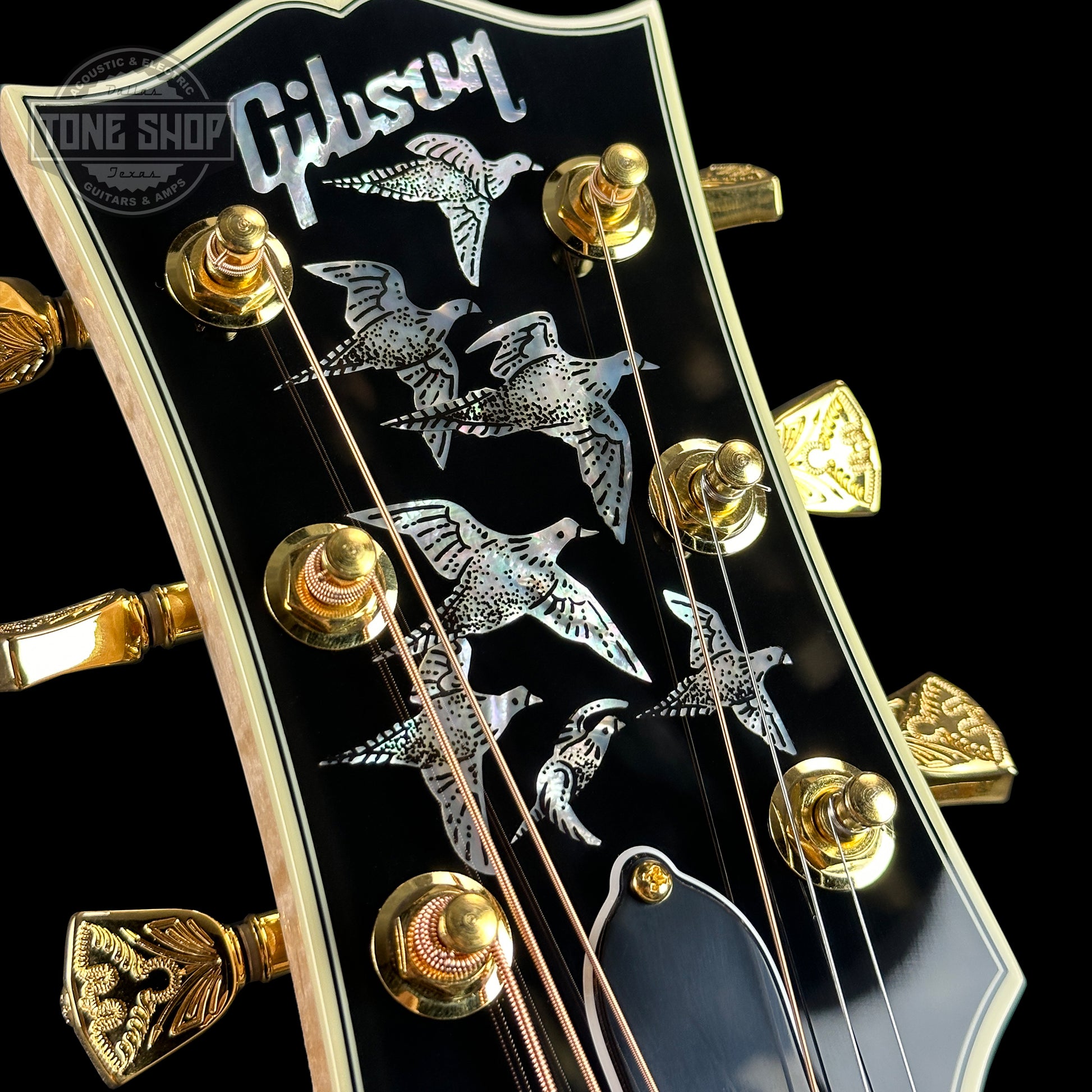 Inlays on front of headstock of Gibson Custom Shop Made 2 Measure All Koa Doves in Flight.