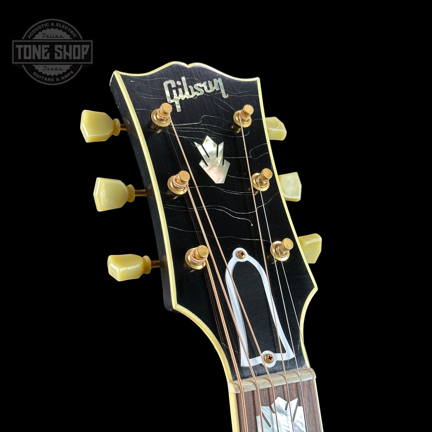 Front of headstock of Gibson Custom Shop M2M 1957 SJ-200 Murphy Lab Light Aged  Ebony.