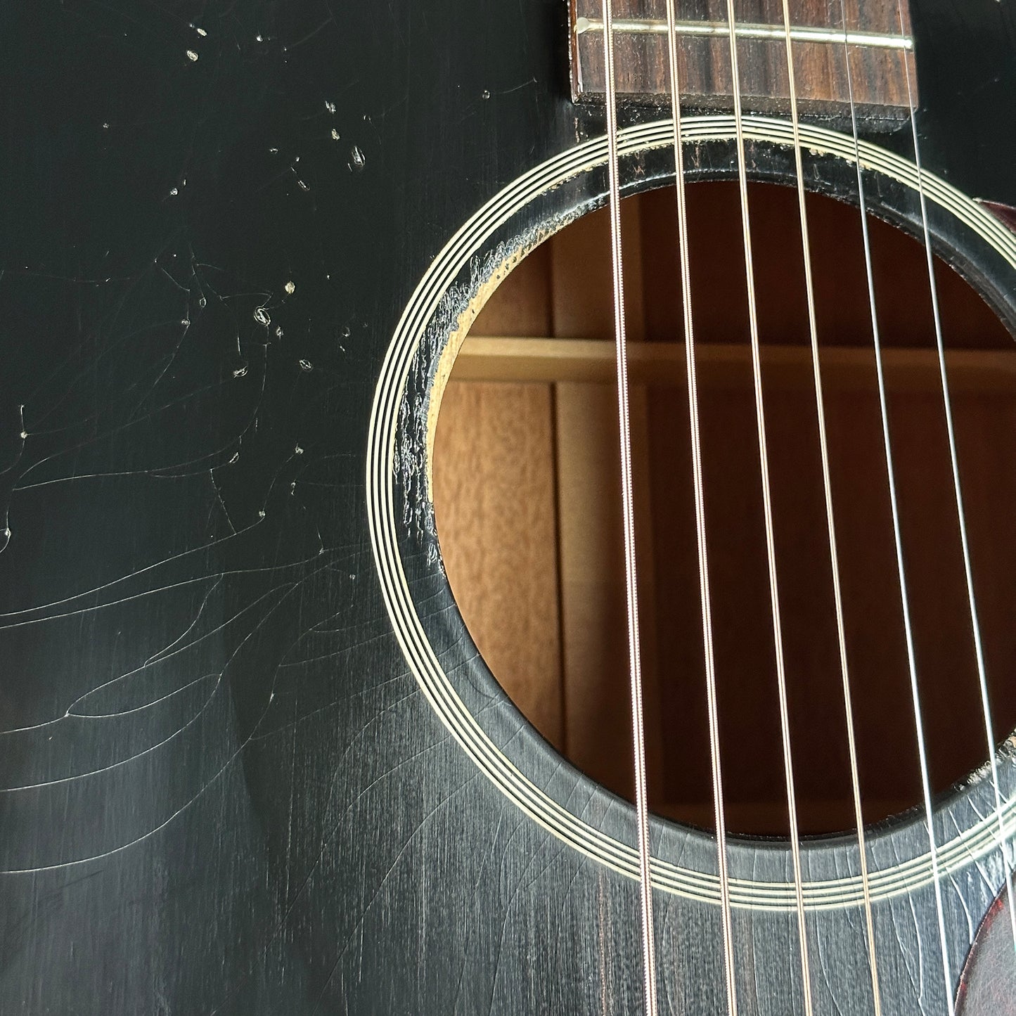 Soundhole of Gibson Custom Shop Made 2 Measure 1942 Banner J-45 Murphy Lab Light Aged Ebony.