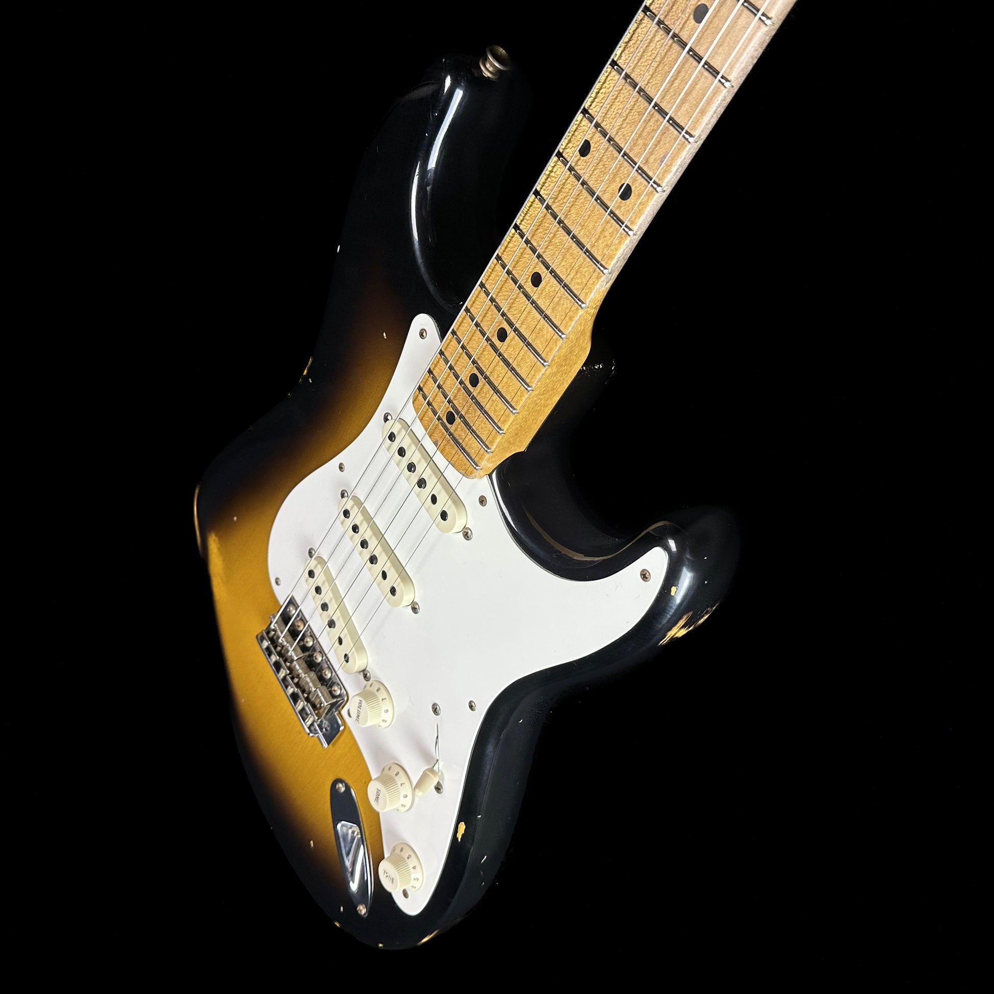 Front angle of Fender Custom Shop Limited Edition '57 Stratocaster Relic Wide Fade 2 Color Sunburst.