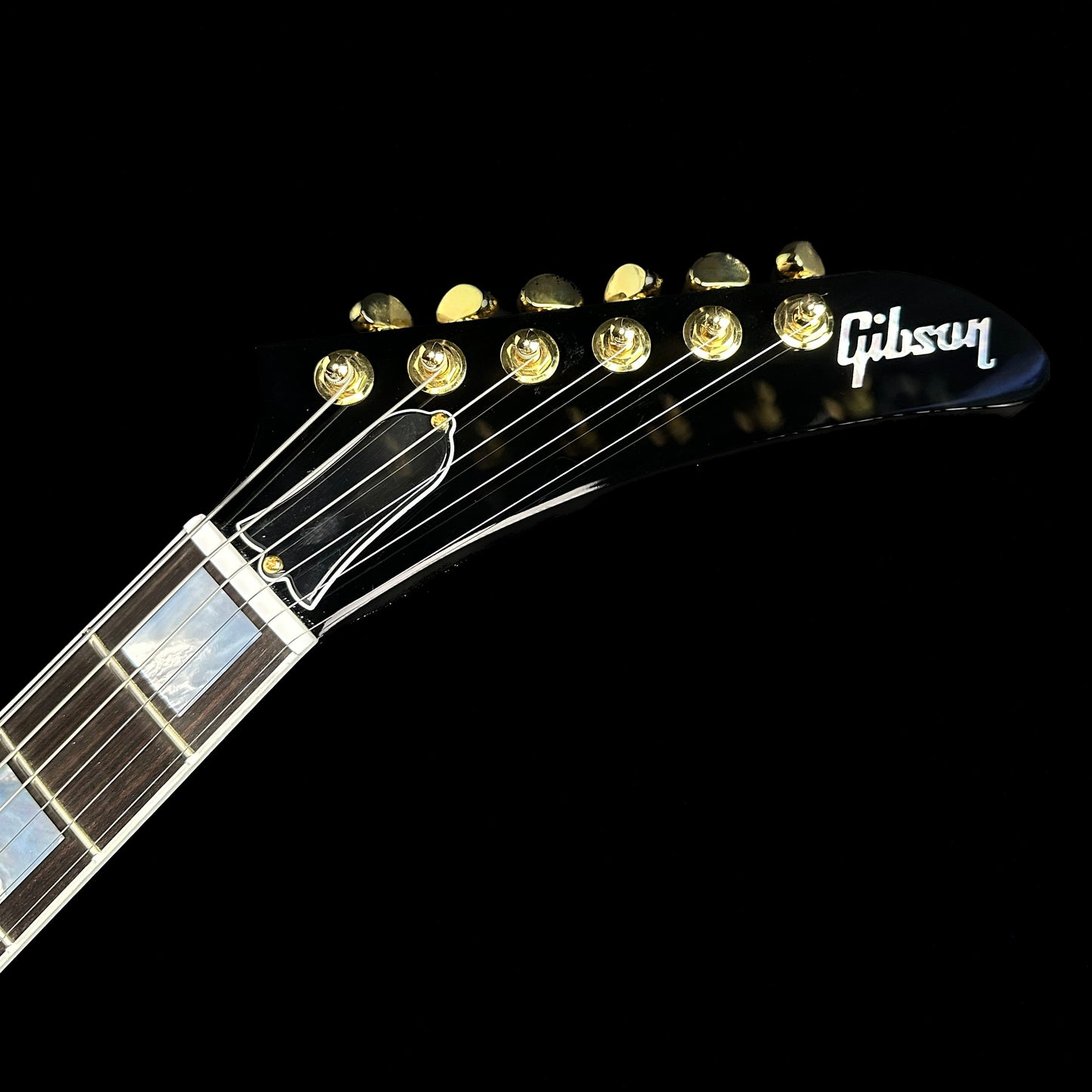 Close up of Gibson Custom Shop Explorer Custom Ebony headstock.