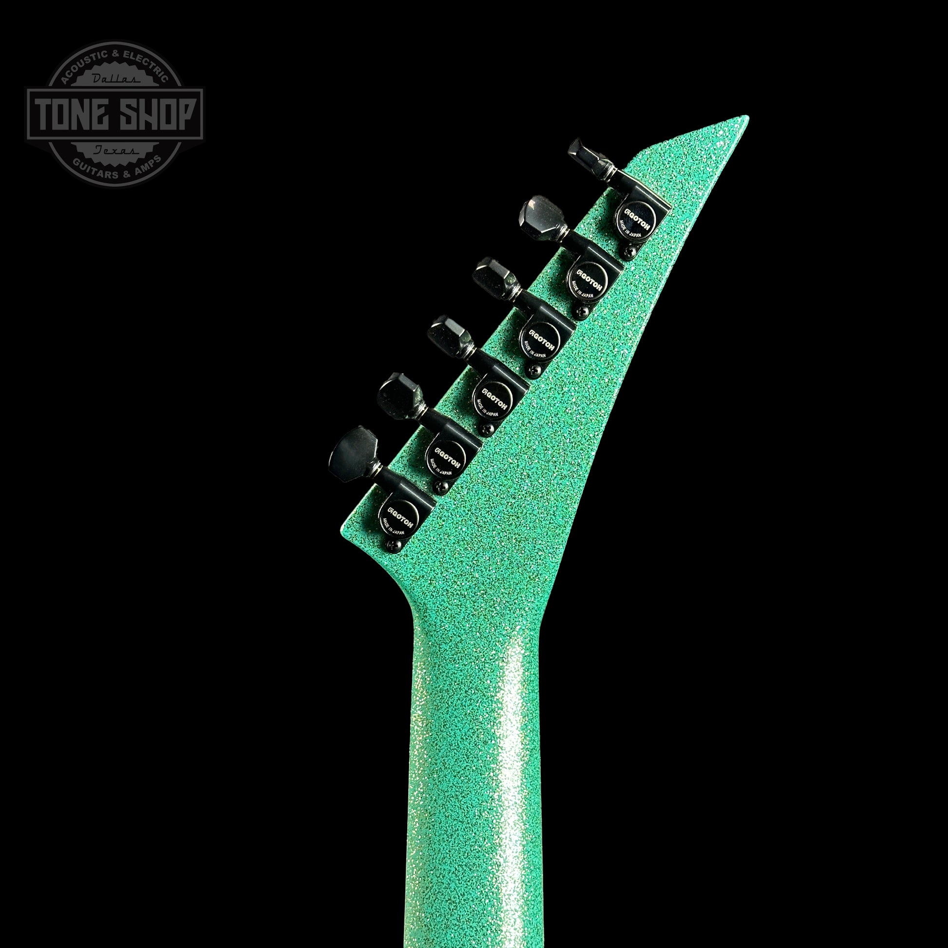 Back of headstock of Jackson Custom Shop SL1 Soloist RVRS FR Seafoam Sparkle.