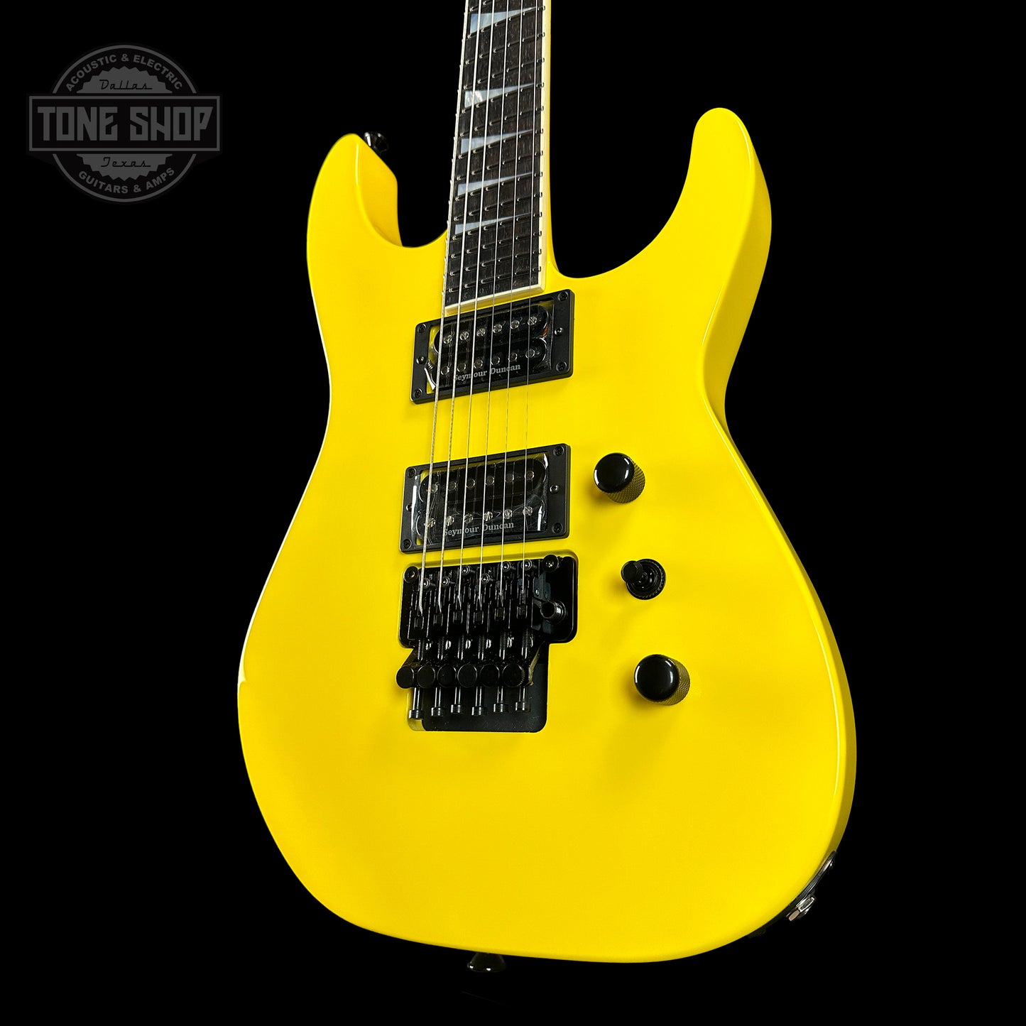 Front angle of Jackson Custom Shop SL2H Reverse Headstock Grafitti Yellow.